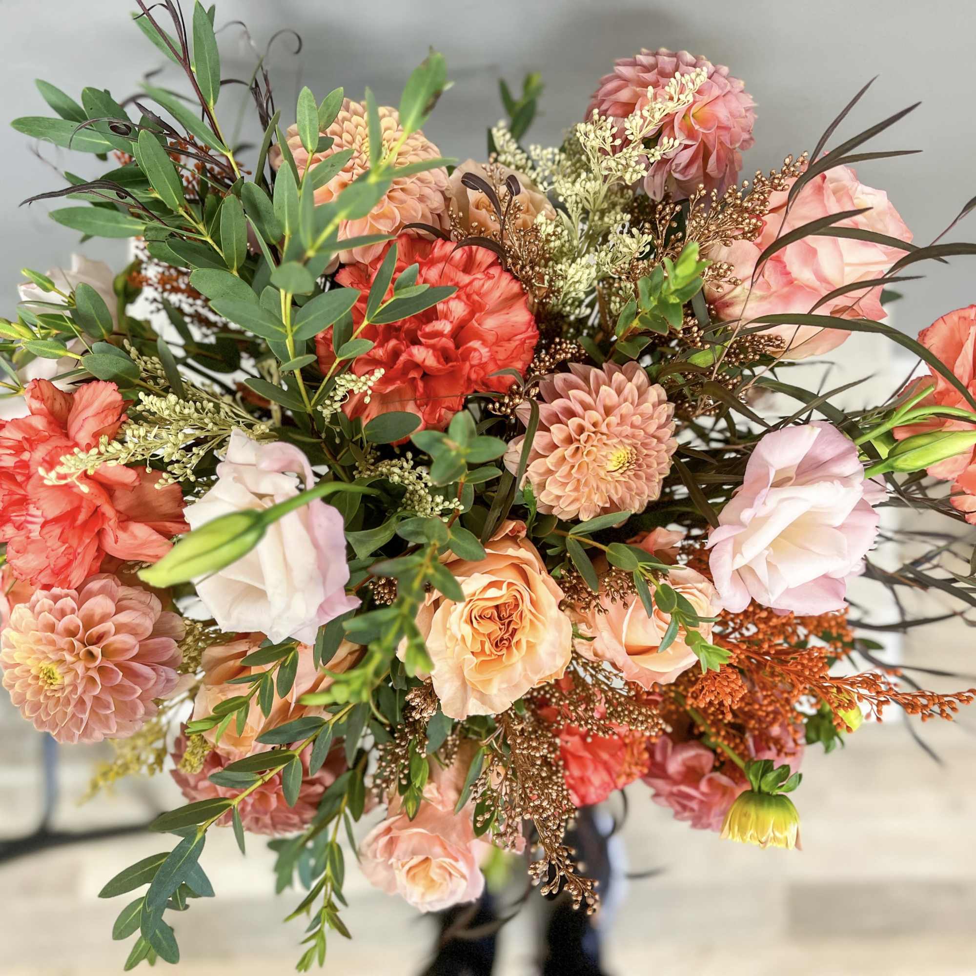 Soft romance meets timeless elegance in this lush garden-style arrangement. Featuring peach