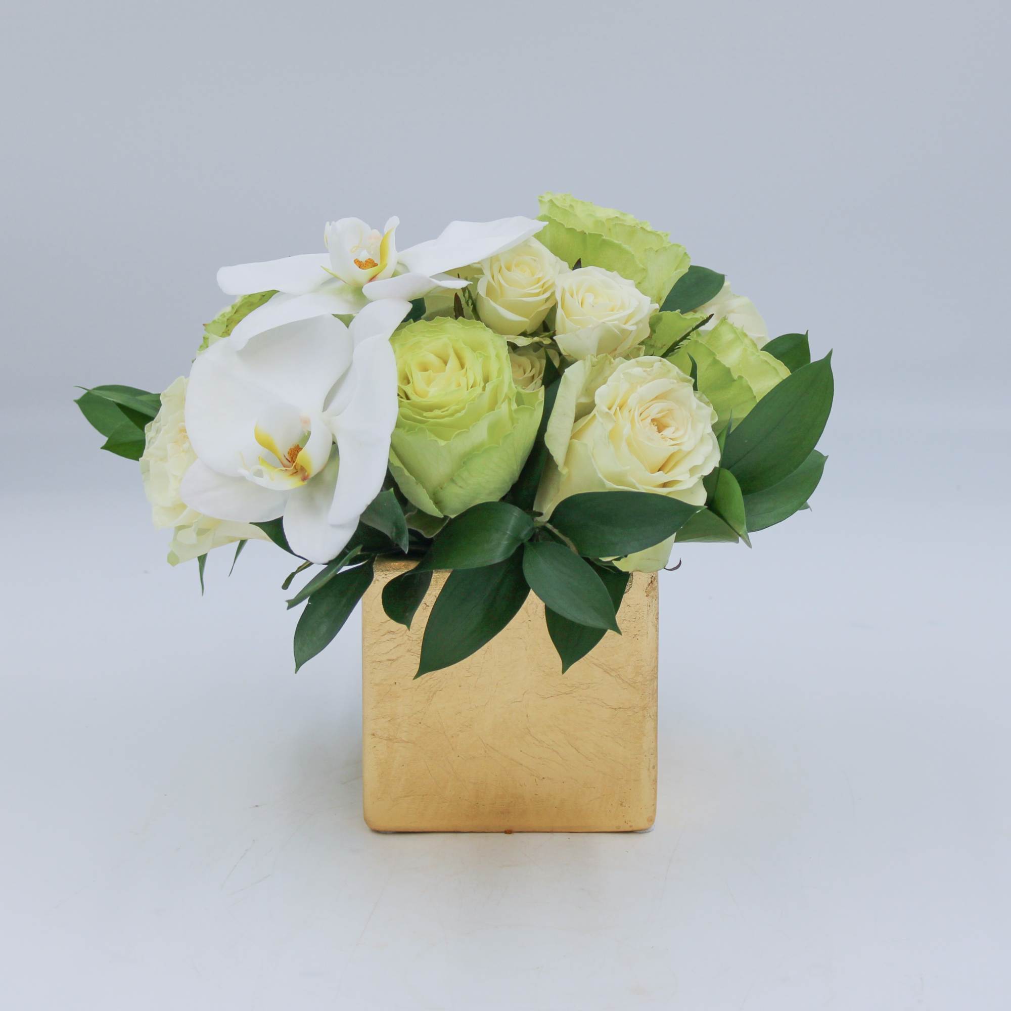Clare is a petite arrangement of Green and White Roses, White Spray