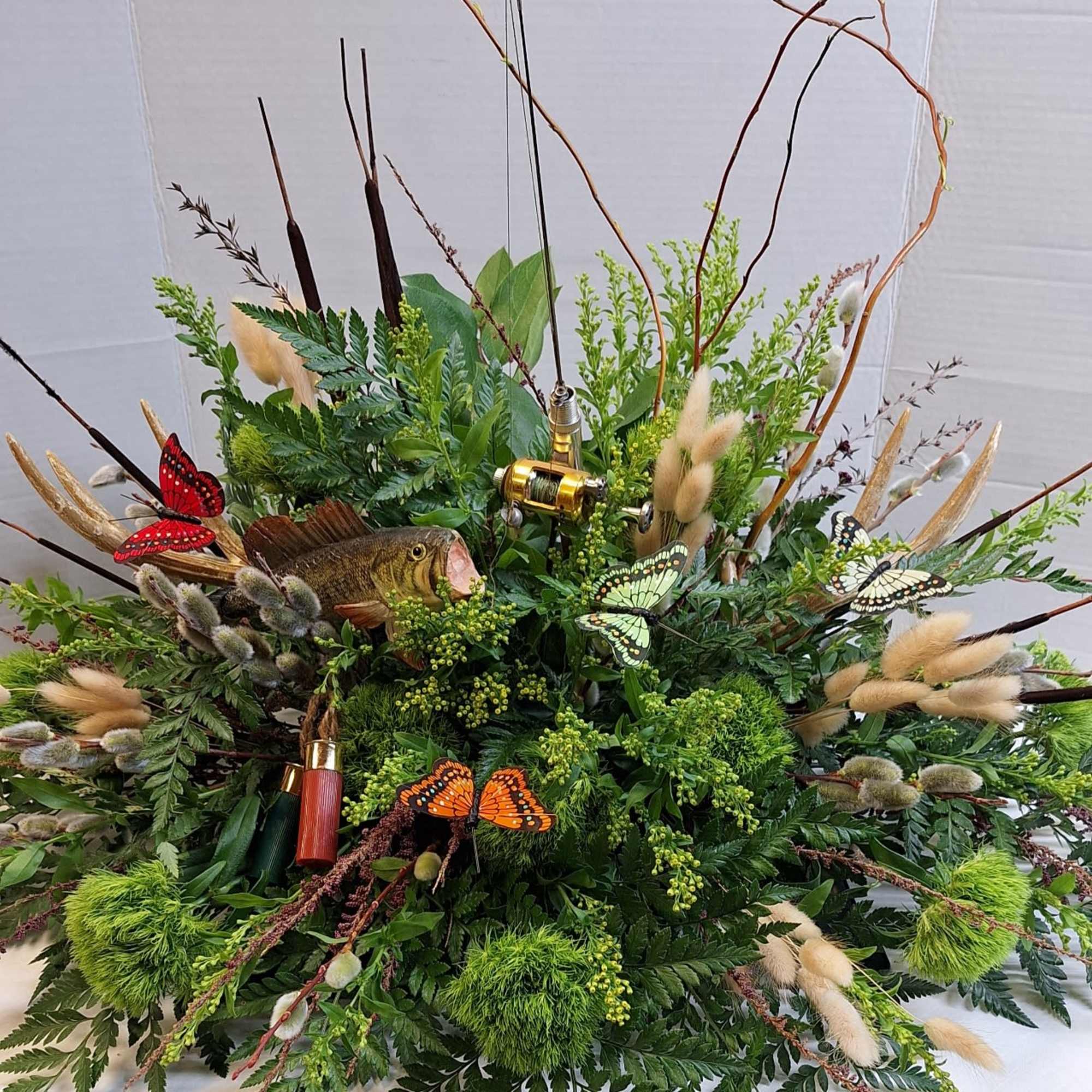 We do themed casket sprays. 
Contact us for more information.