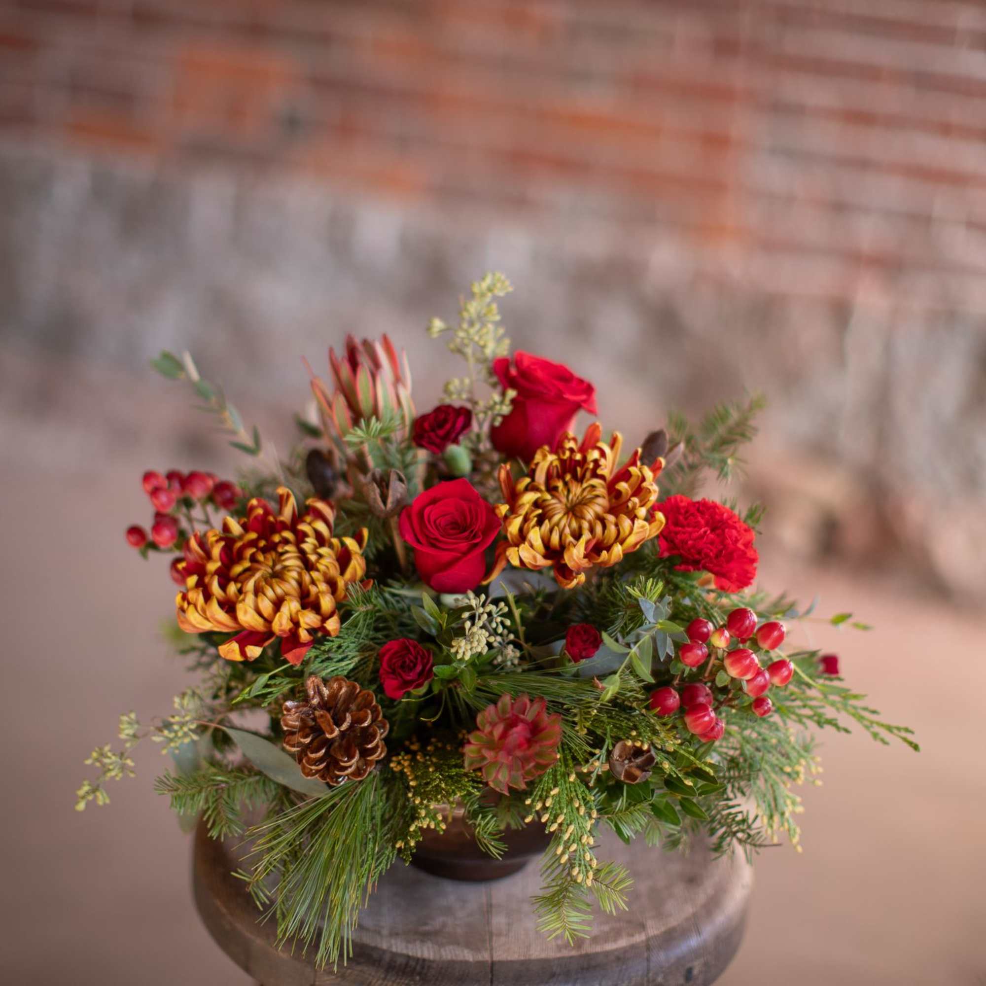 In the center of this brassy-bronze metal compote style dish is a