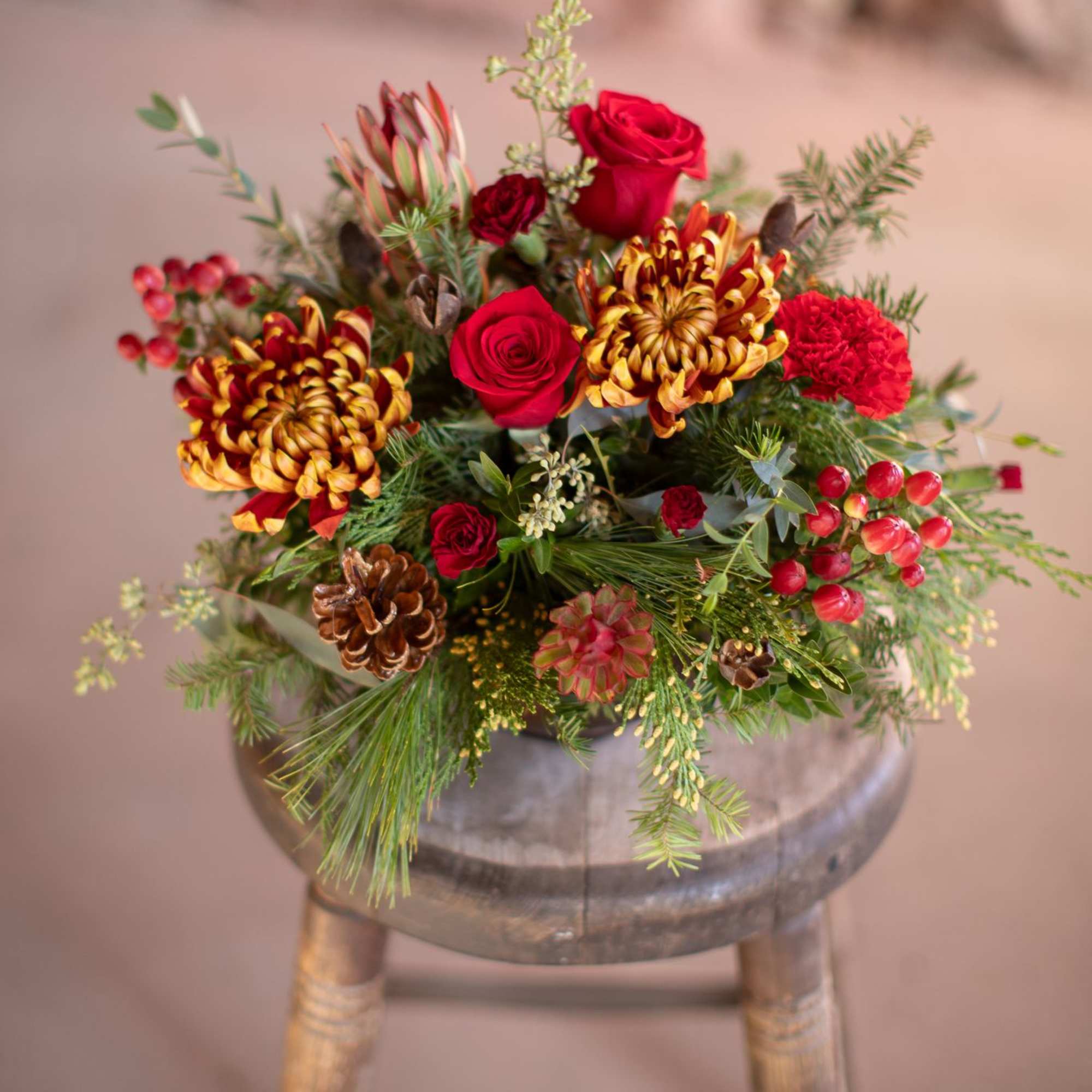 In the center of this brassy-bronze metal compote style dish is a