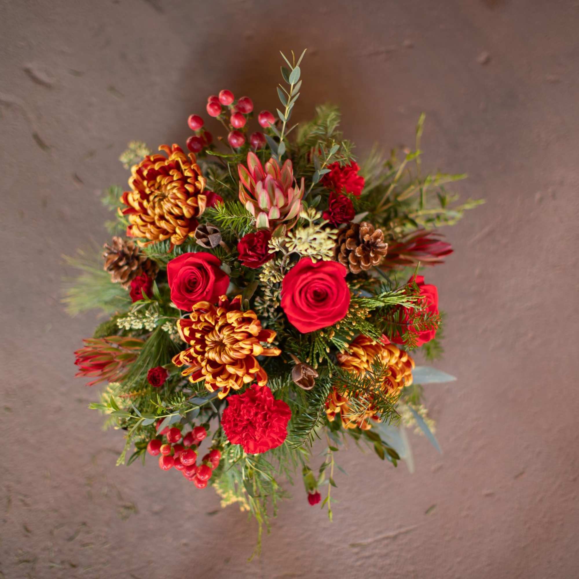 In the center of this brassy-bronze metal compote style dish is a
