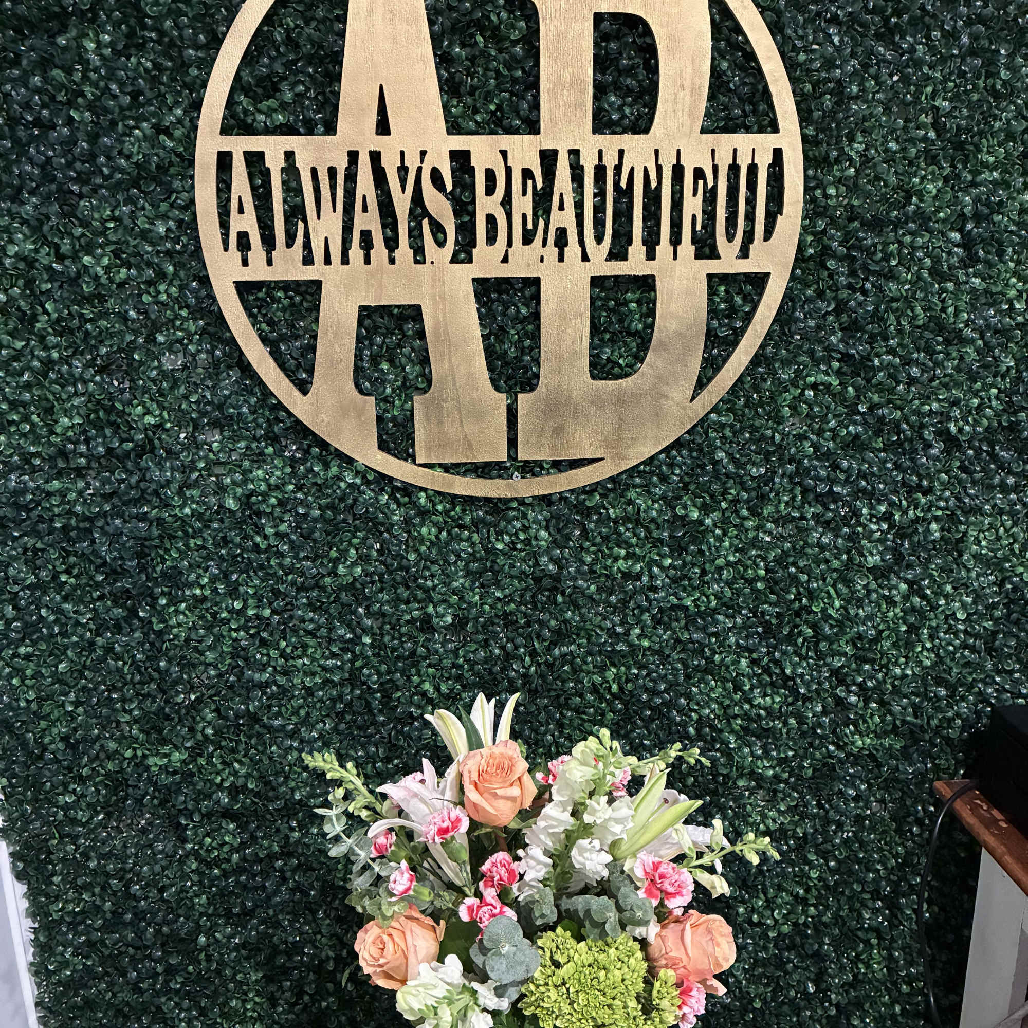 A soft, romantic mix arranged in a modern leaf-wrapped glass cube. Designed