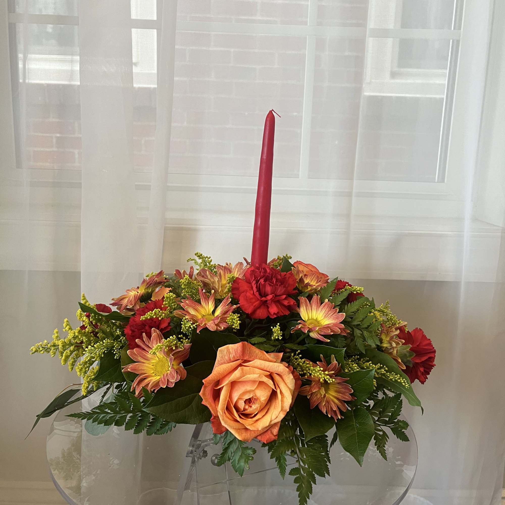 A warm, low-profile Thanksgiving centerpiece designed to sit beautifully on your dining