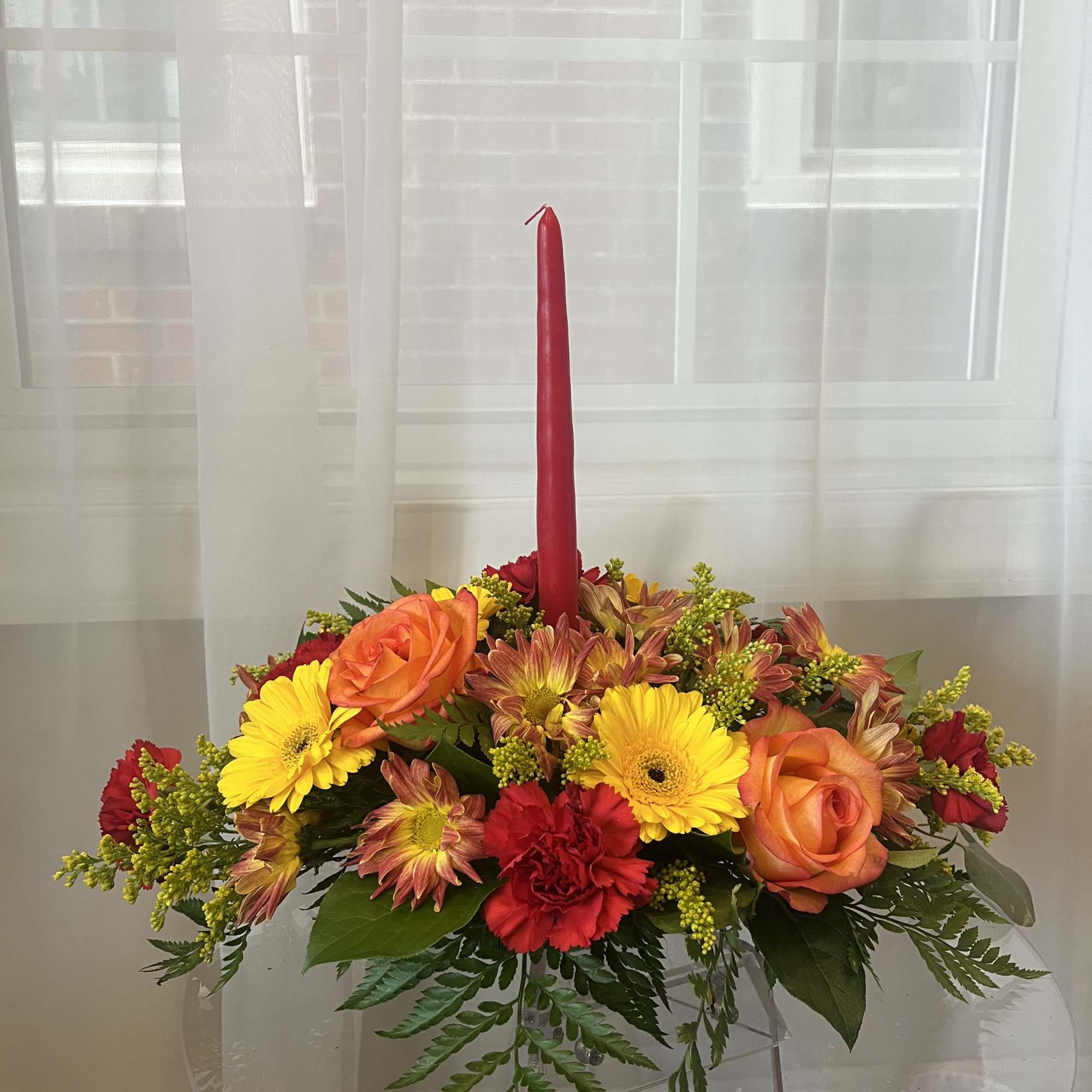 A warm, low-profile Thanksgiving centerpiece designed to sit beautifully on your dining