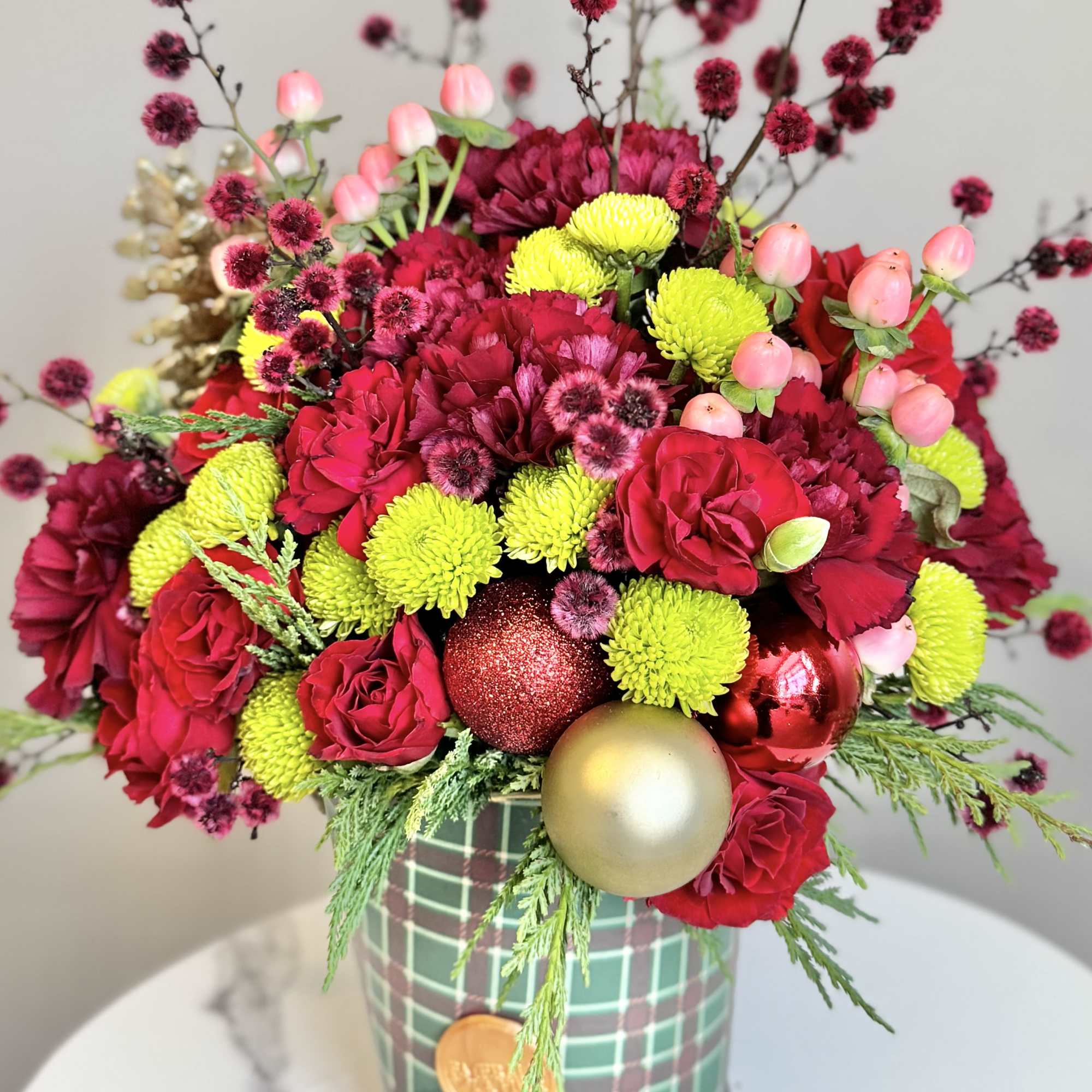 This holiday theme bouquet will bring cheer and lift spirits! Flowers with