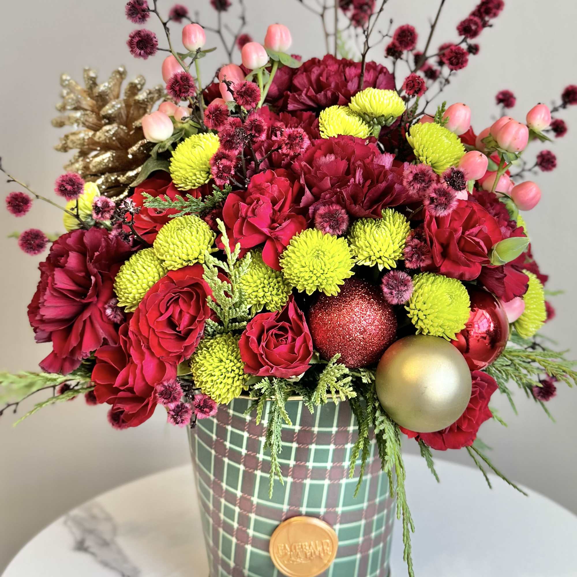 This holiday theme bouquet will bring cheer and lift spirits! Flowers with