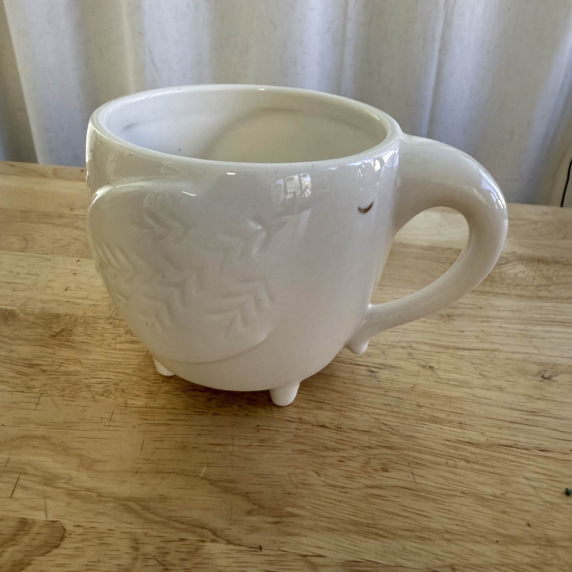 A sweet and charming arrangement featuring soft pink roses, daisies, and fresh