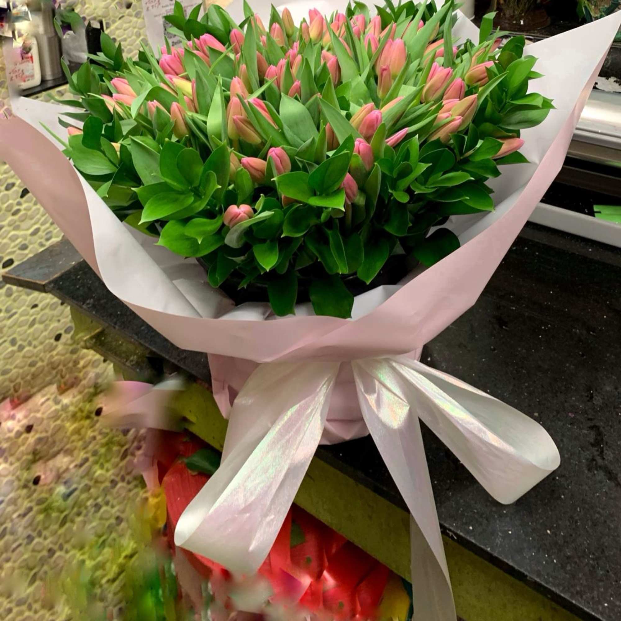 Fresh cut tulips arranged in hand wrapped bouquets.  Please call for