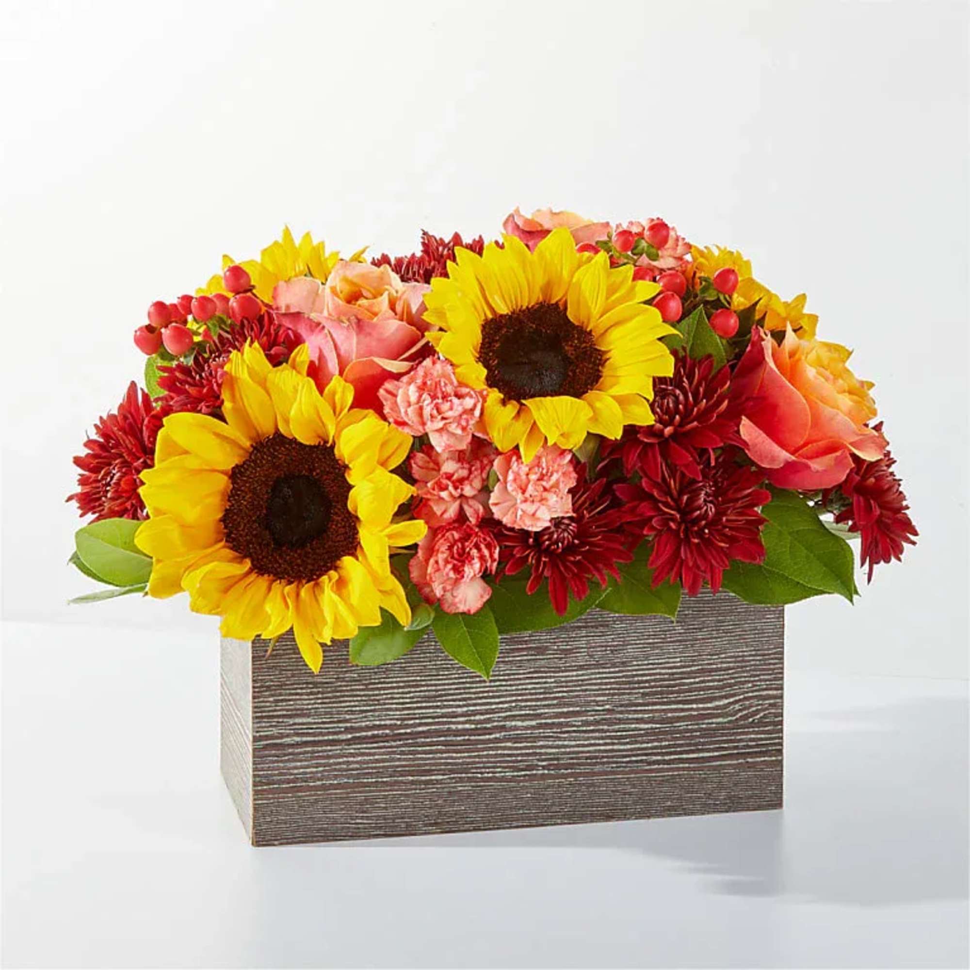 This arrangement will have you dreaming of autumnal spices with rich red