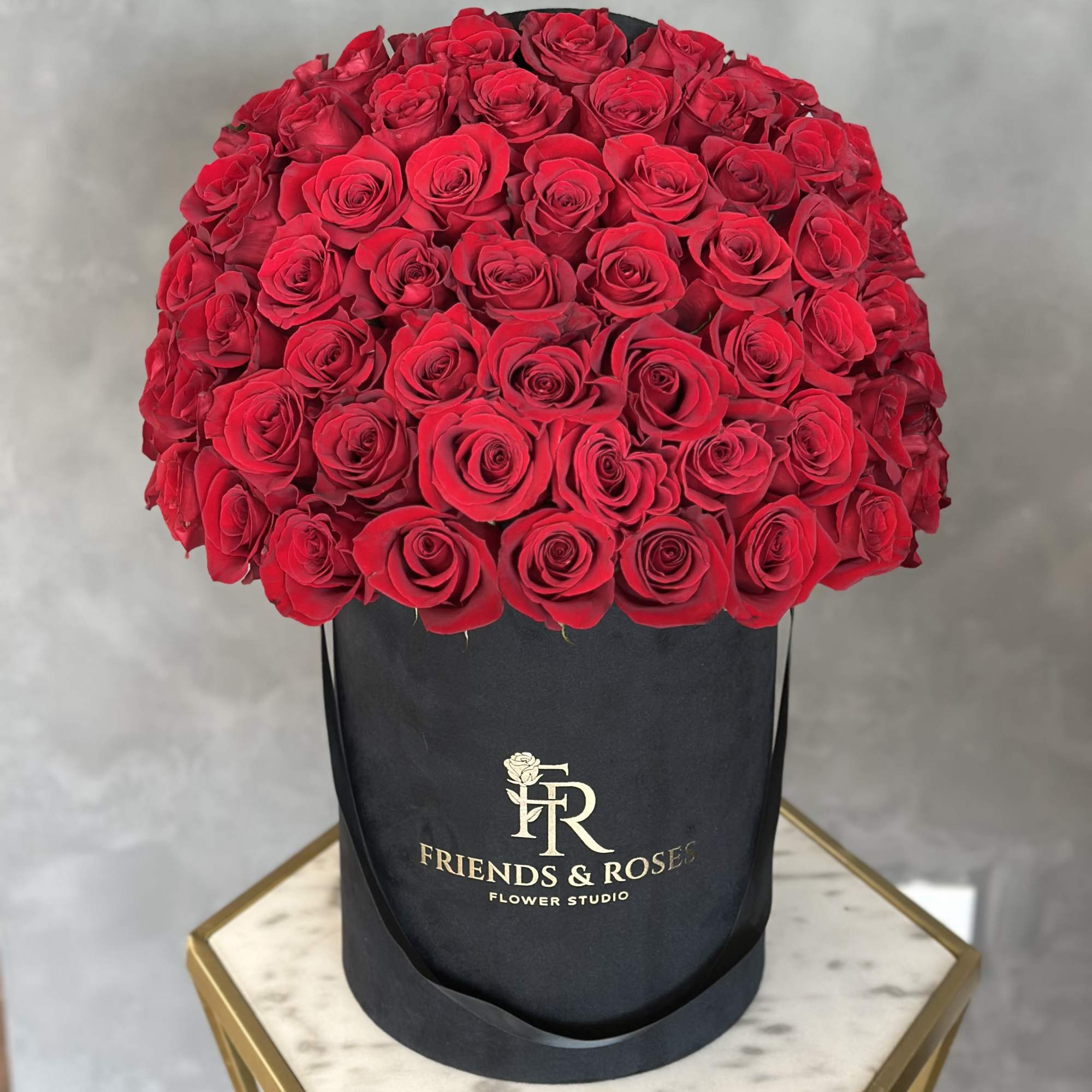 50 red roses in a black velvet box