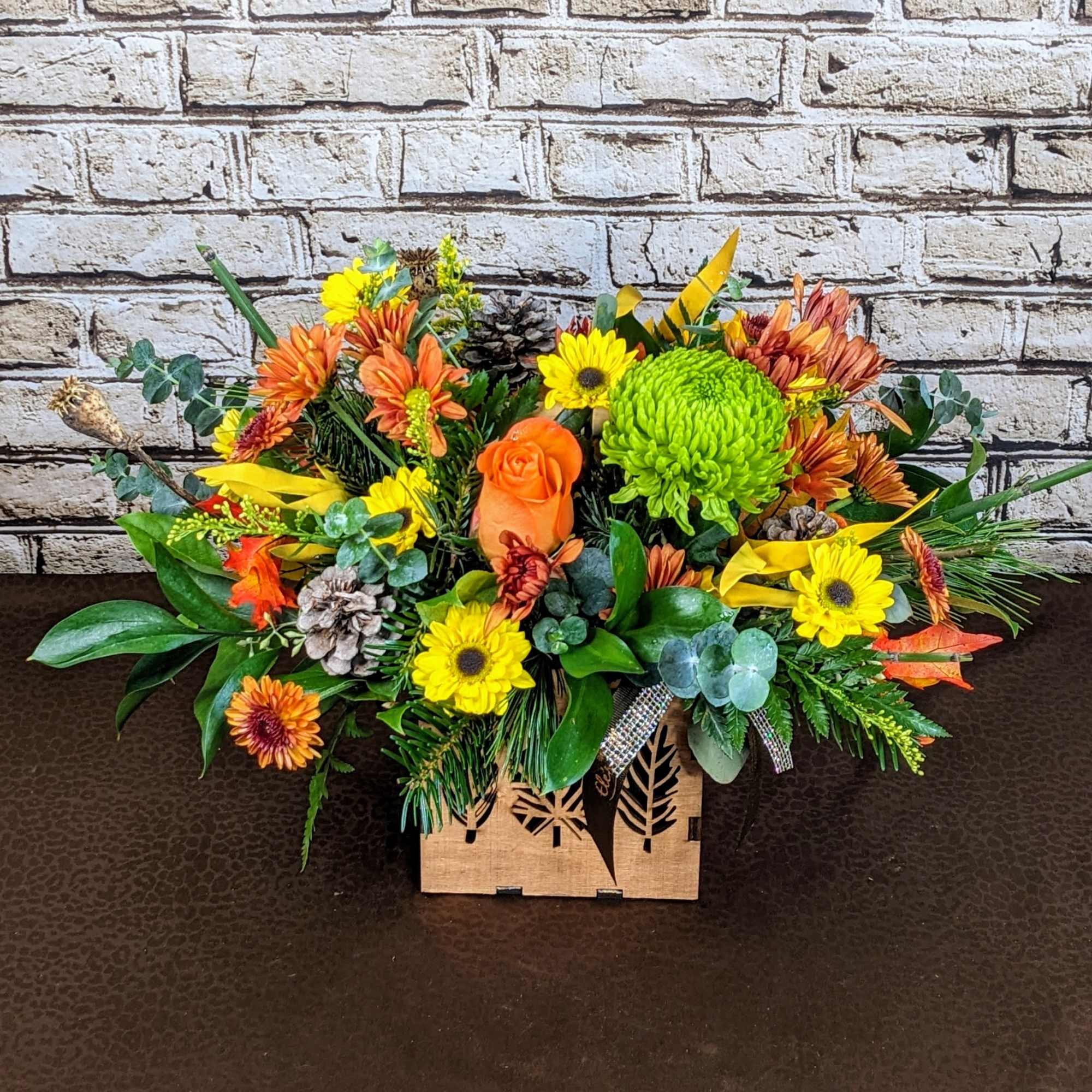 This Thanksgiving centerpiece exudes the beauty of the season with its rich