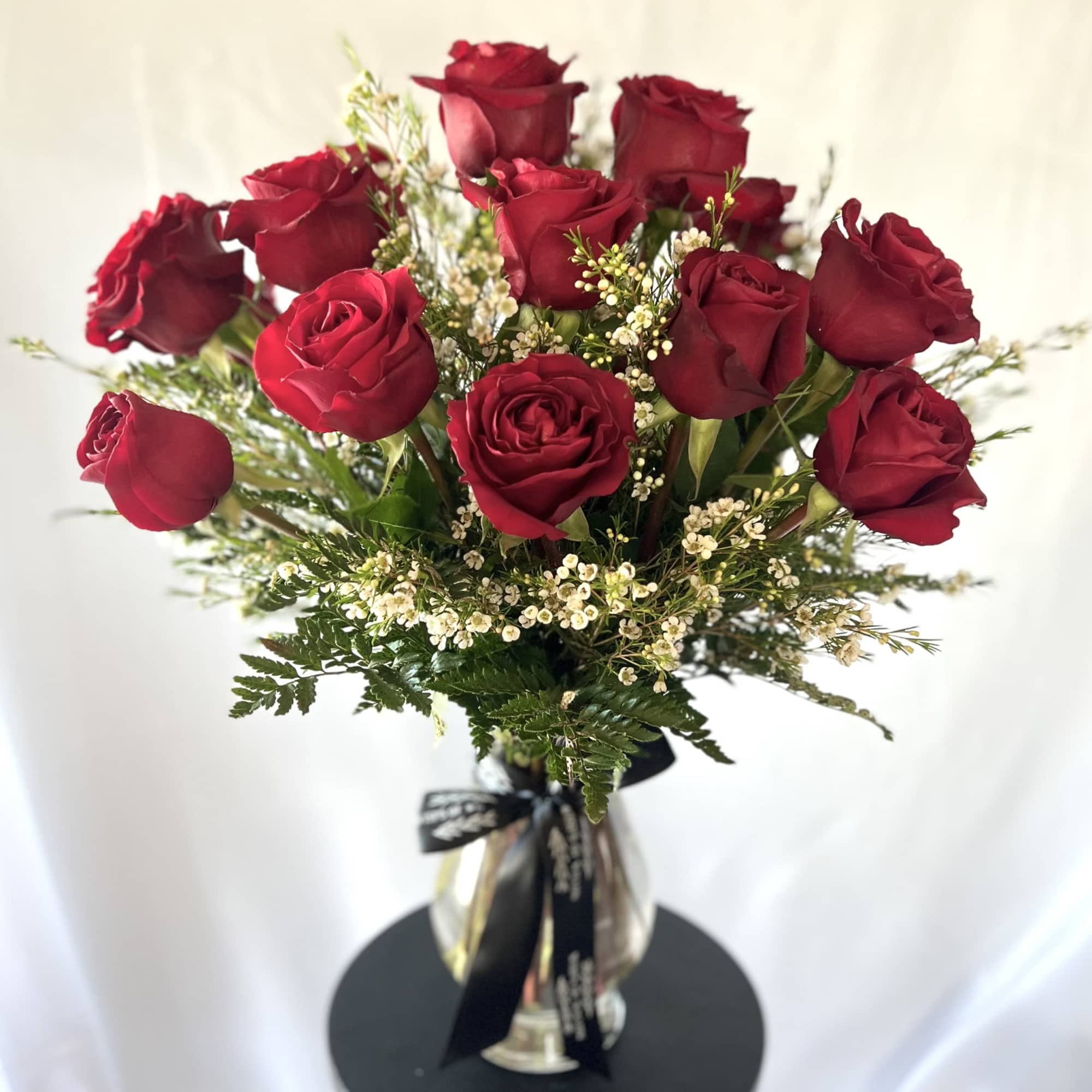 Each arrangement is delivered with a handwritten card.