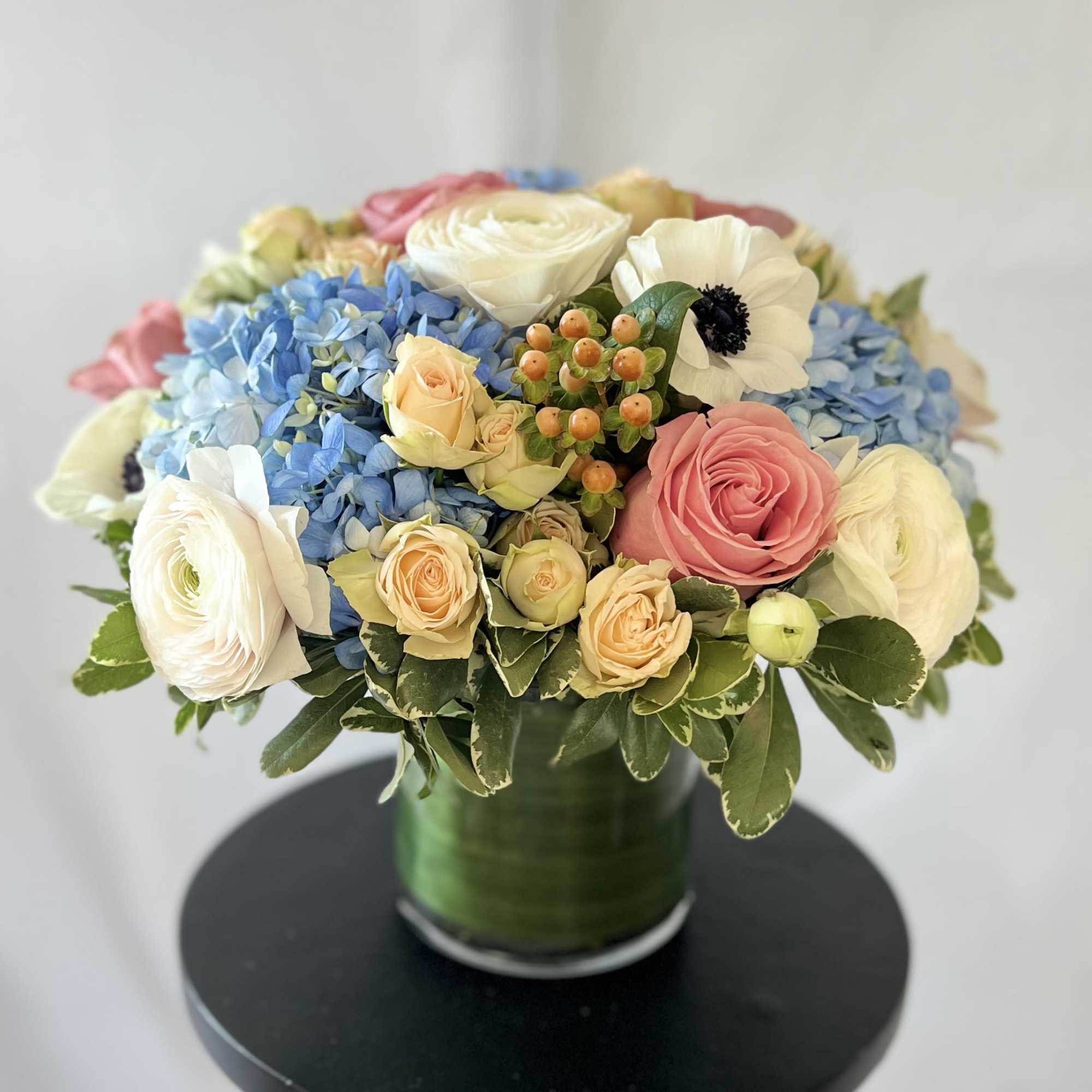 An exquisite and modern styled arrangement of our prettiest pastel blooms from