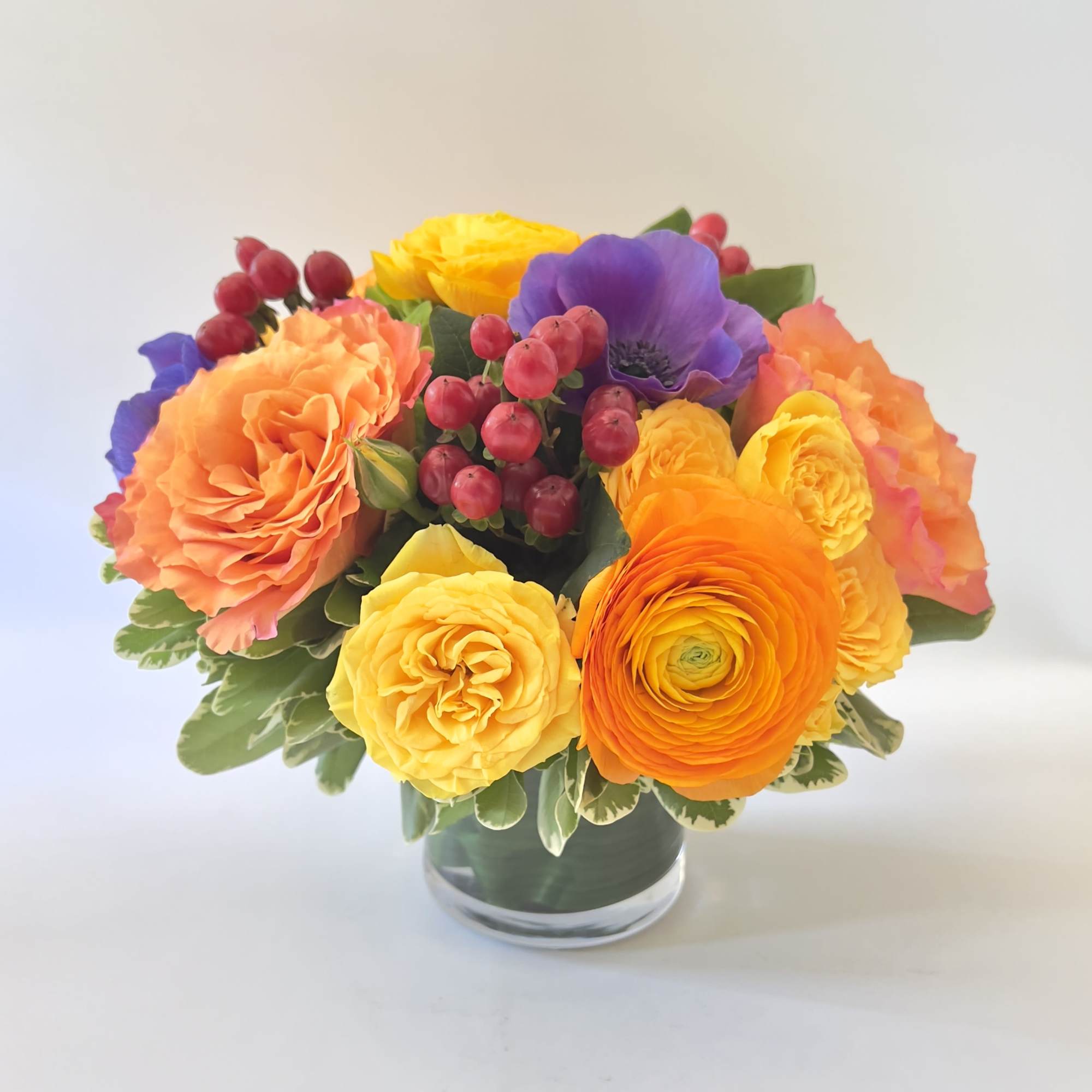 An exquisite and modern styled arrangement of our brightest colored blooms from