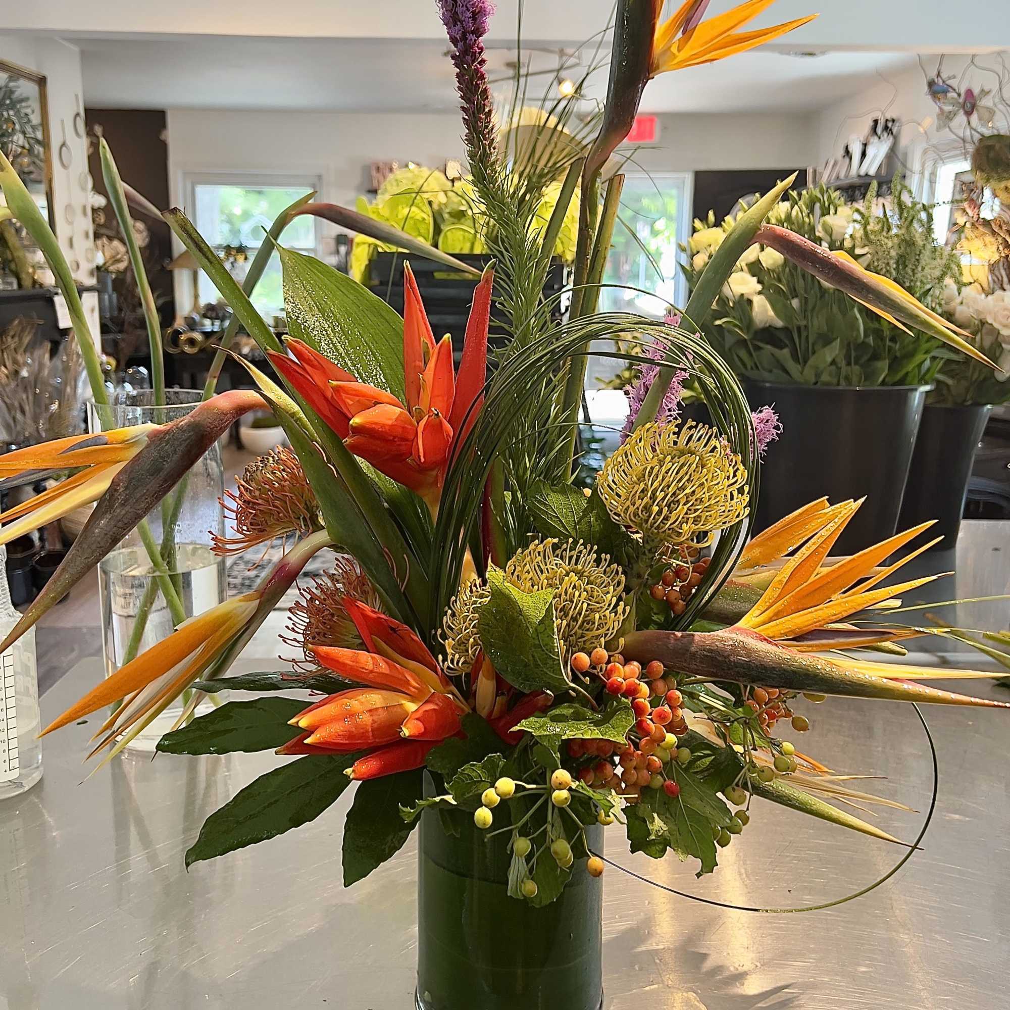 An exquisite arrangement of our tropical blooms from our weekly Studio Theme.

Specific