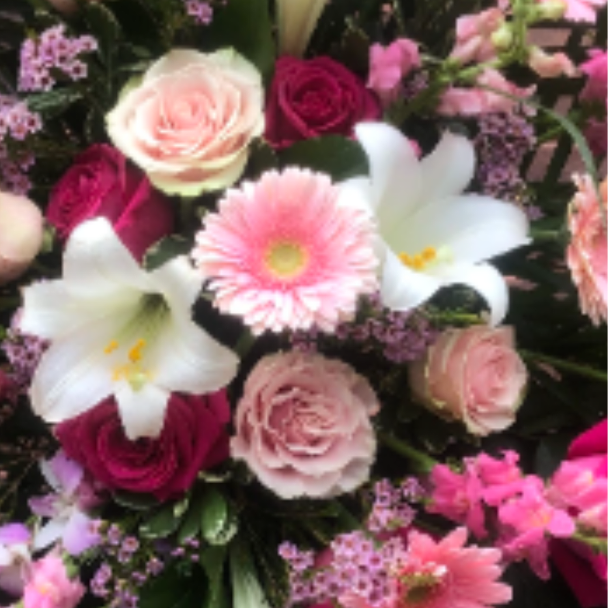 Lilies, Snapdragon, Assorted Roses, Gerbera Daisies, Dendrobium Orchods, Assorted Fancy Greens