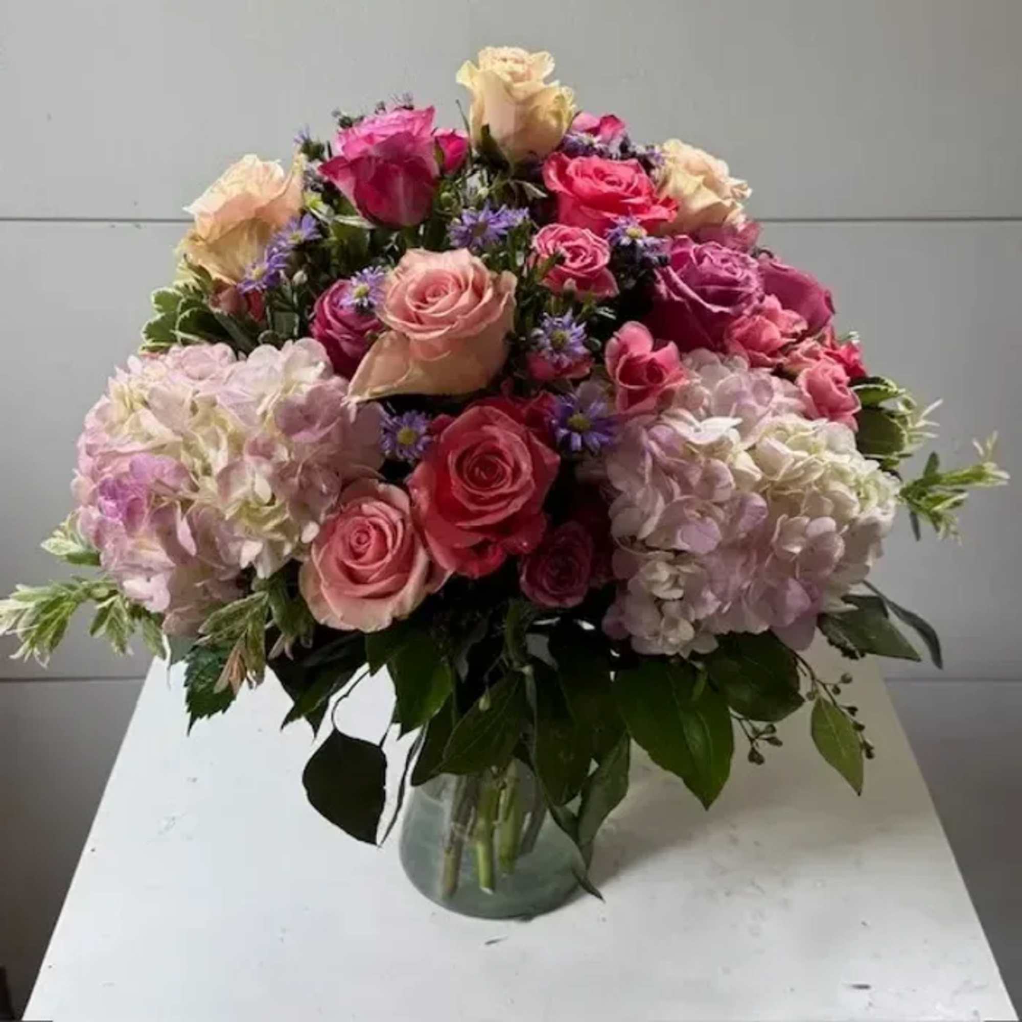 This softly elegant gesture of condolence and affection honoring the memory of