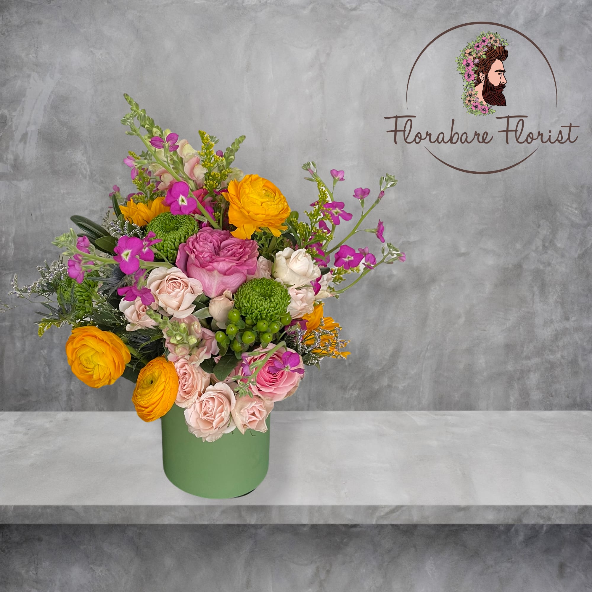 Lush floral design filled with vibrant colors. Consisting of seasonal flowers and
