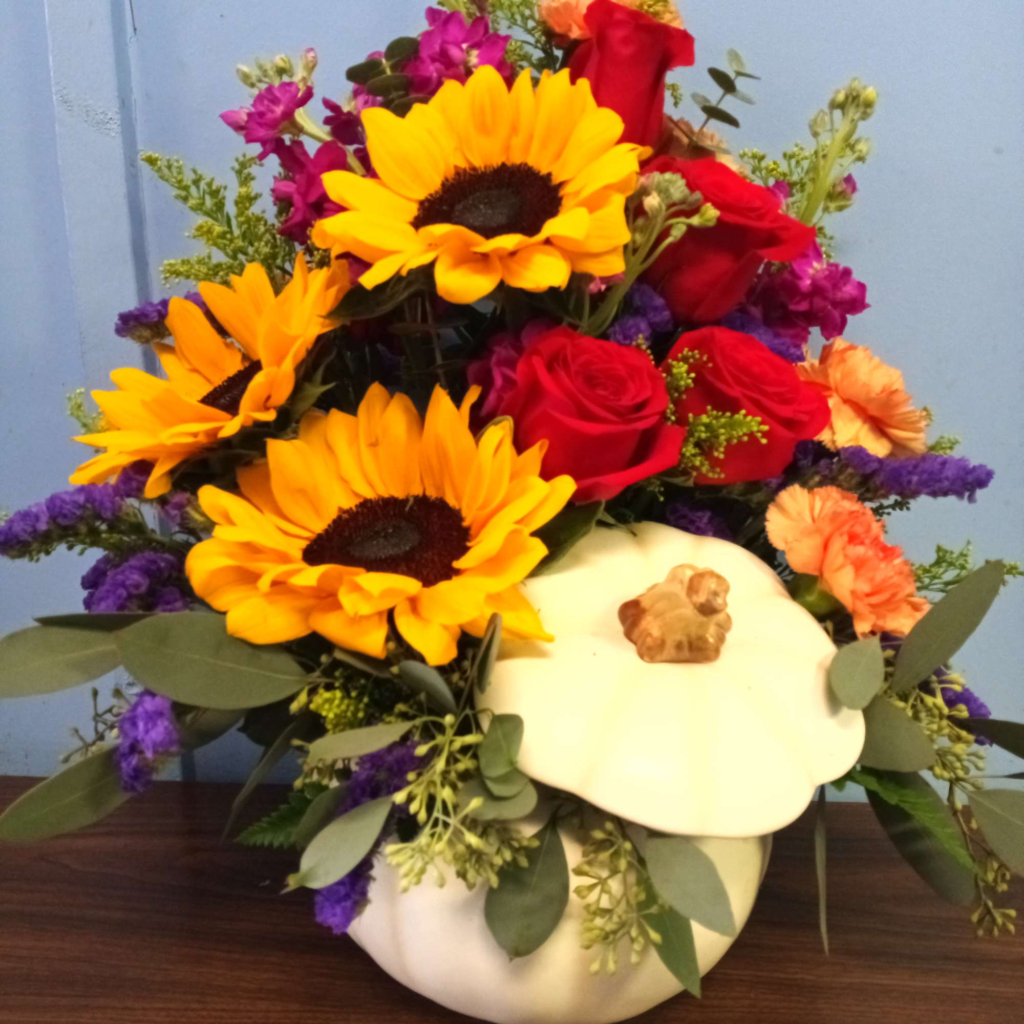 A bountiful pumpkin overflowing with premium fall flowers. A great addition to