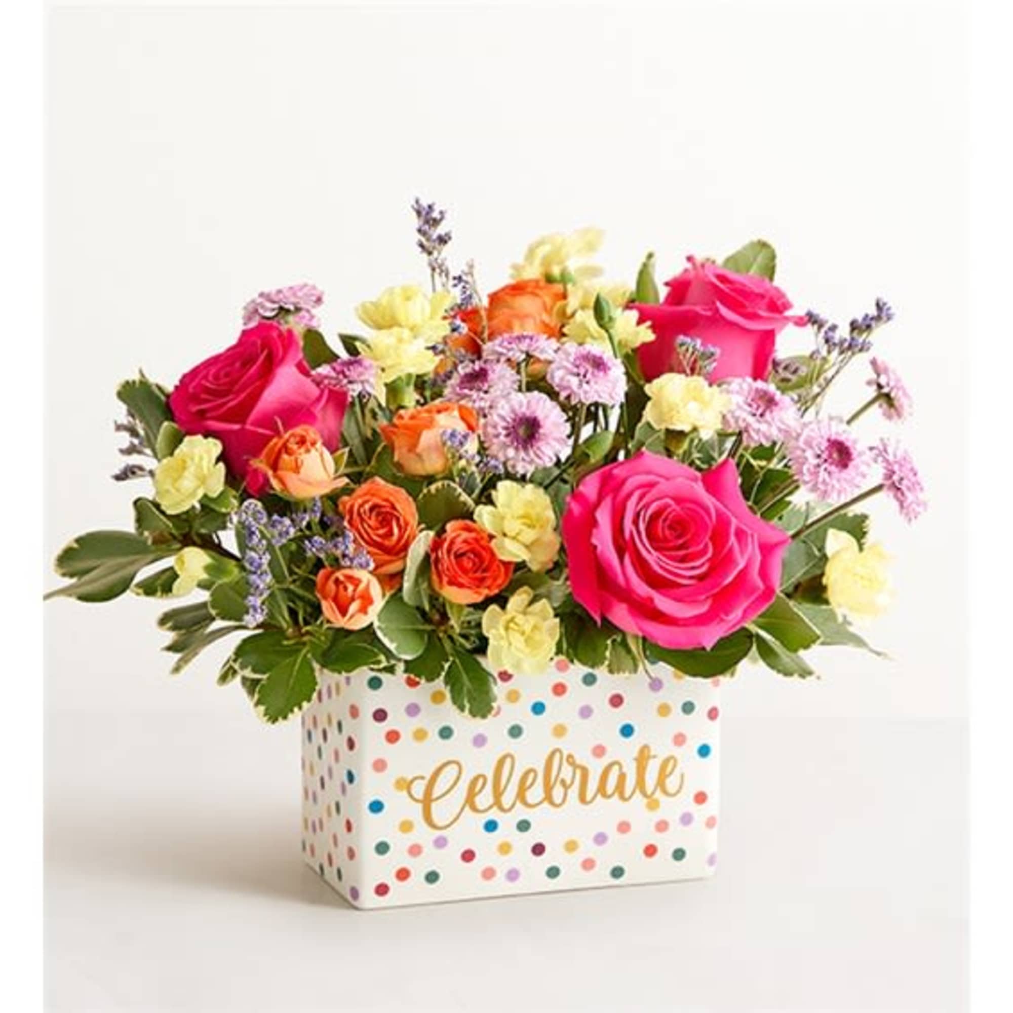 In a special container.
Hot pink rose, orange spray rose, purple buttons, and