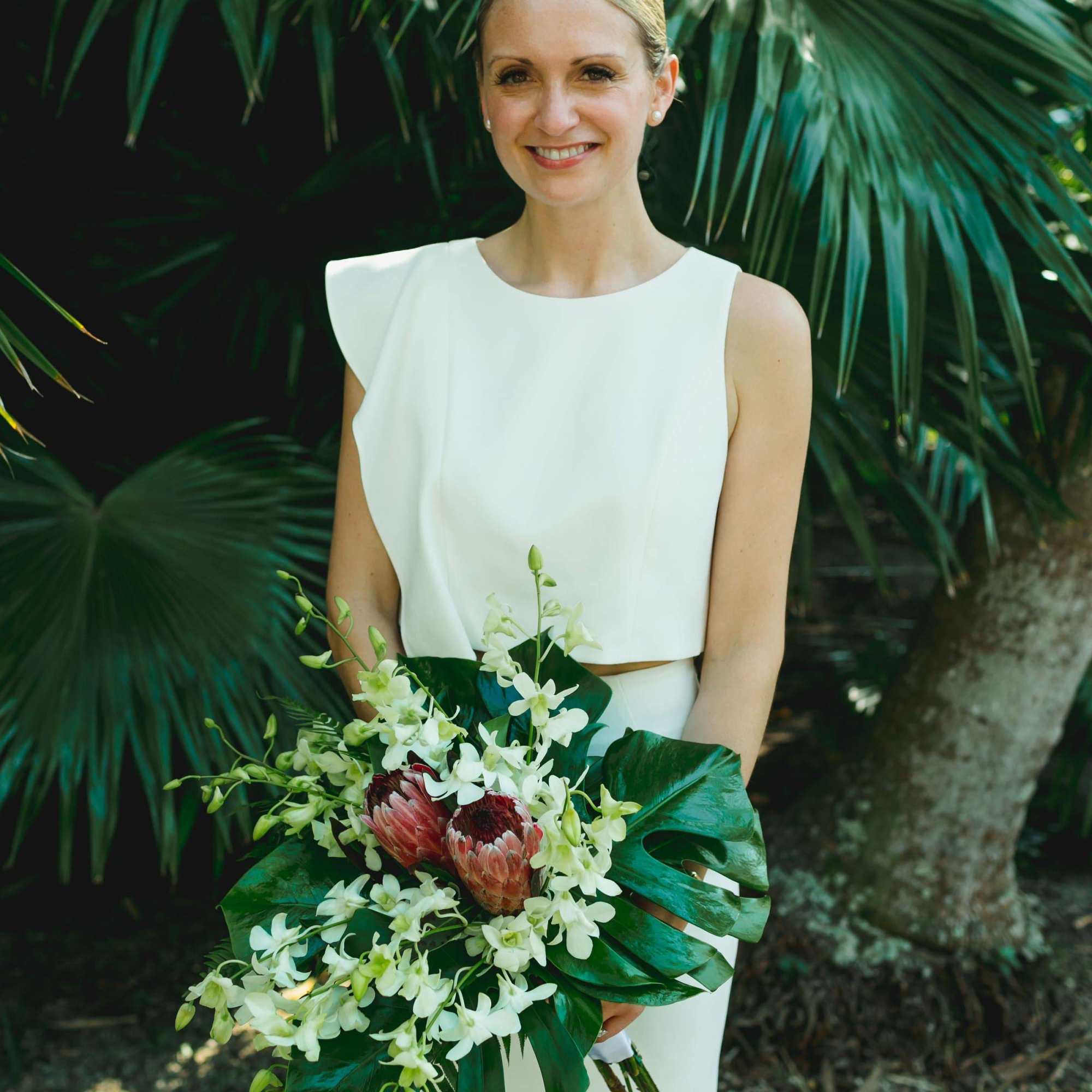 Indulge in the elegance of our Whitney Tropical Wedding Bouquet. Crafted with