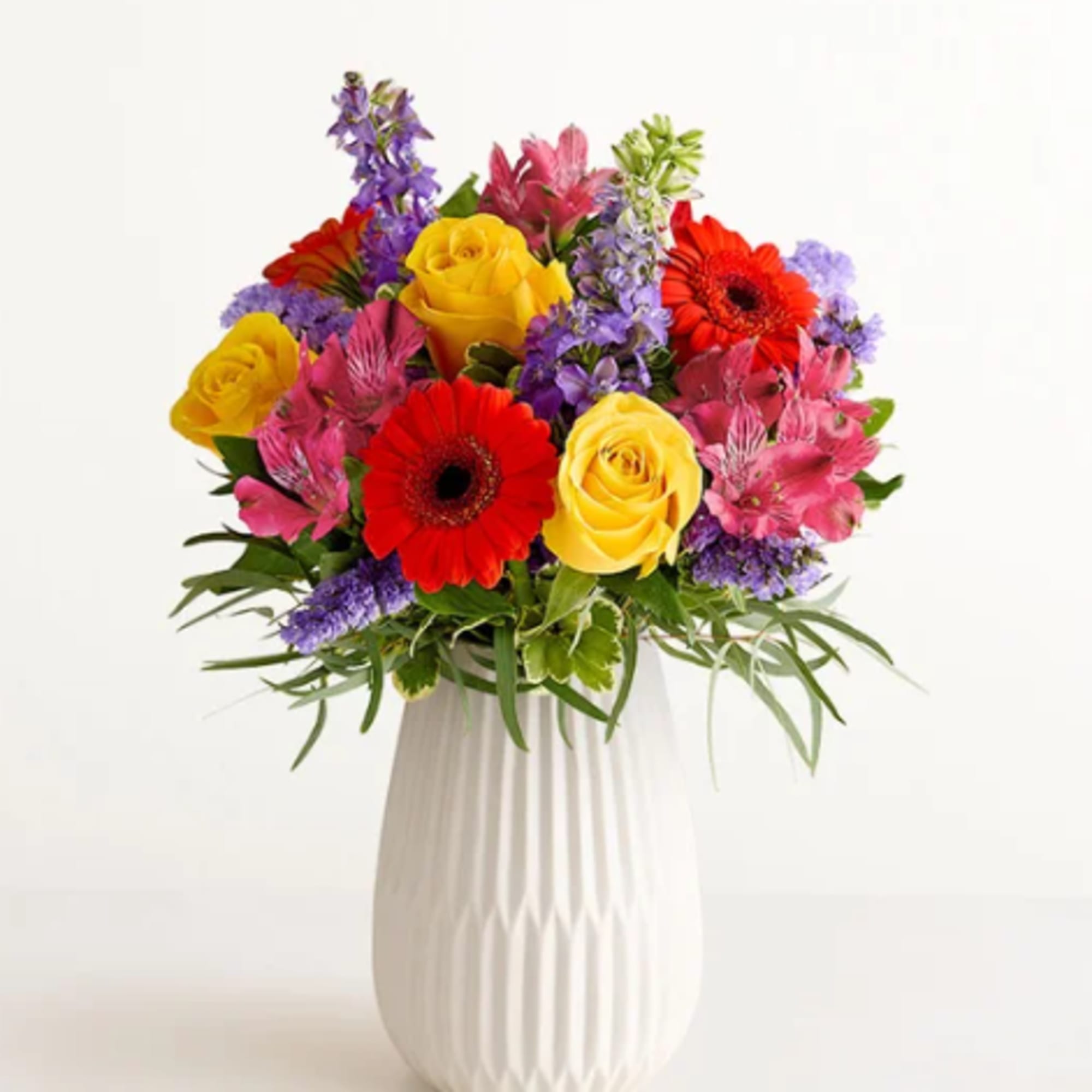 Hit all the right notes with our radiant everyday bouquet. Hand designed