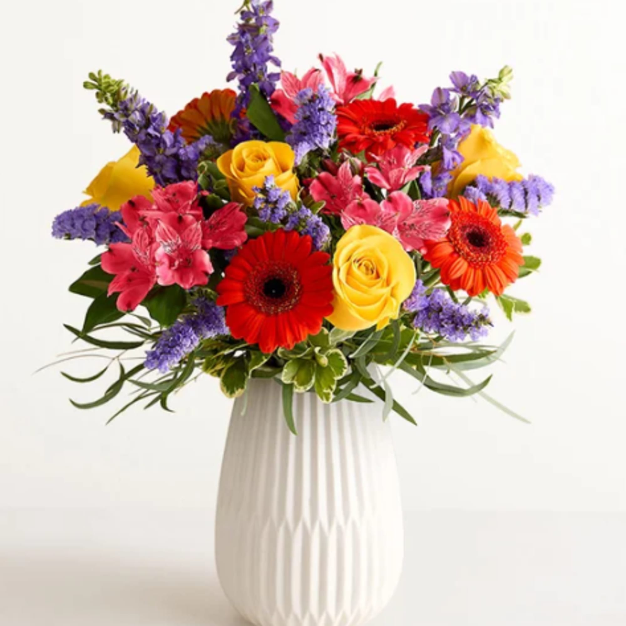 Hit all the right notes with our radiant everyday bouquet. Hand designed