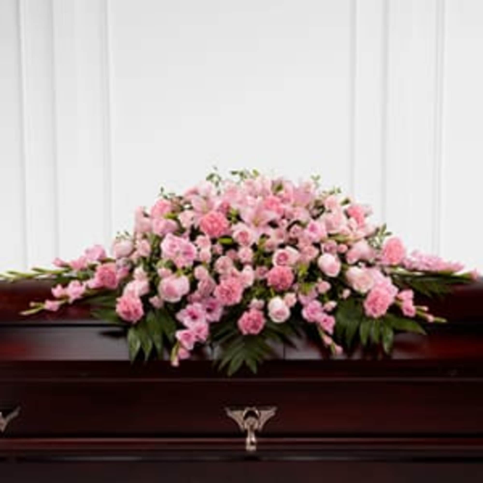 The FTD; Sweetly Rest; Casket Spray is a wonderful way to commemorate