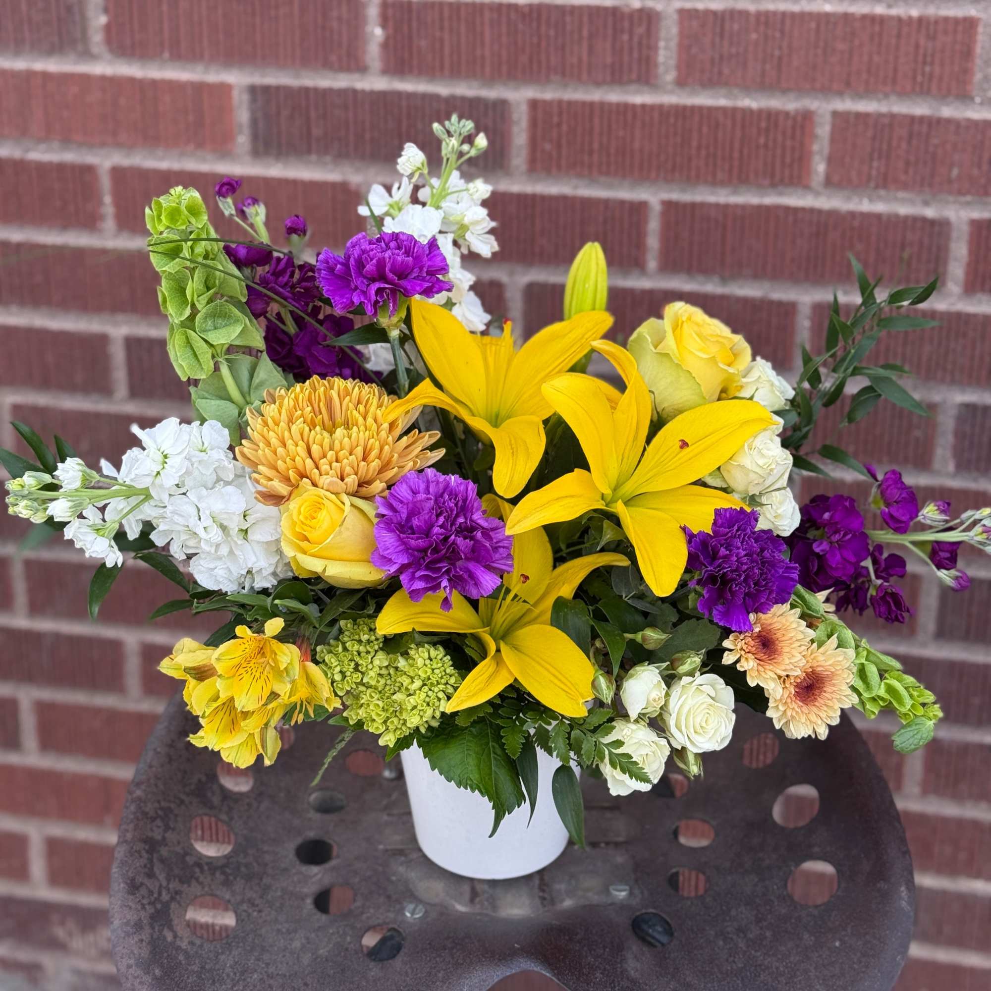 In a lush, garden style and arriving in a neutral toned ceramic