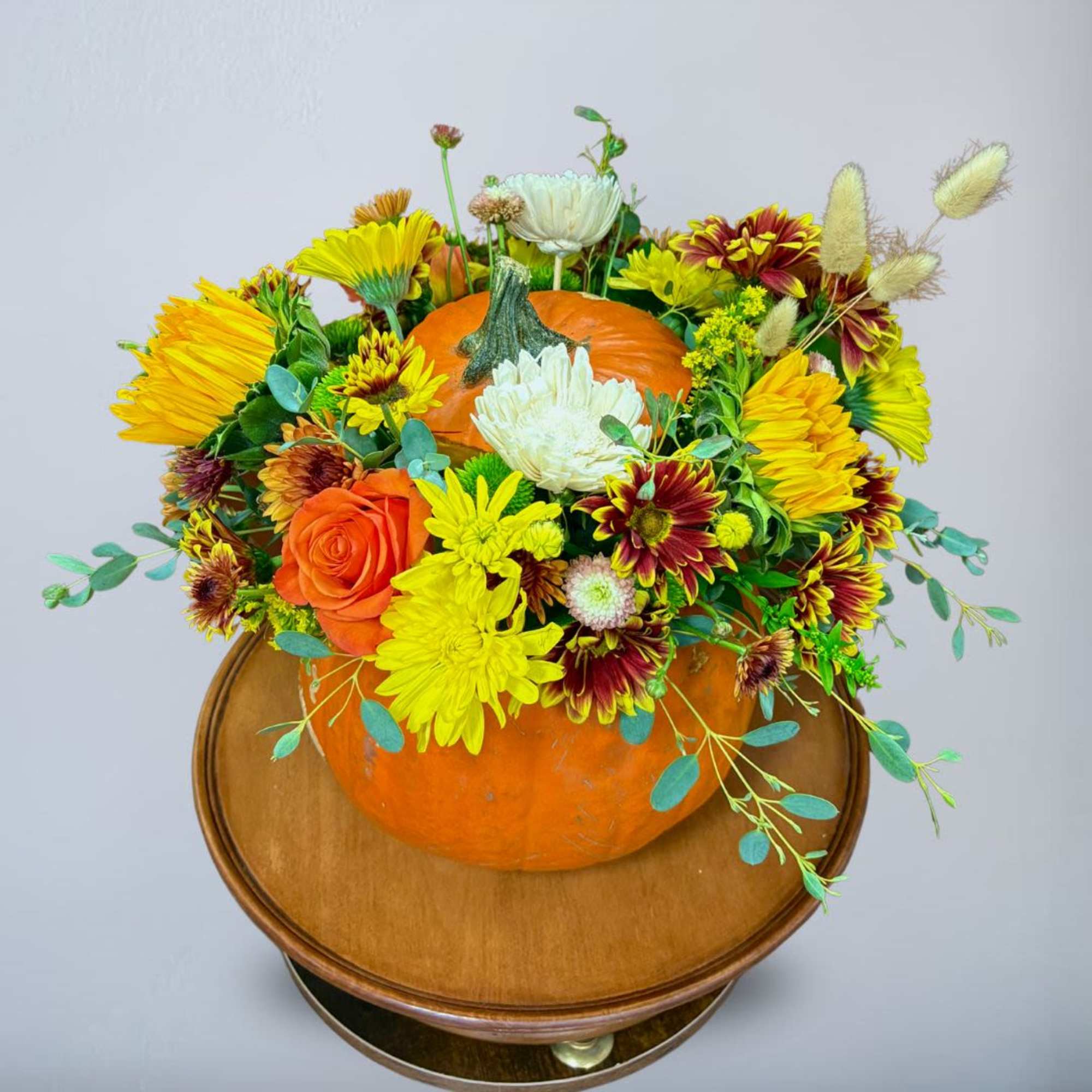 Type of Flowers: Yellow Gerberas, Sunflowers, Pink and Orange Roses, Orange Spray