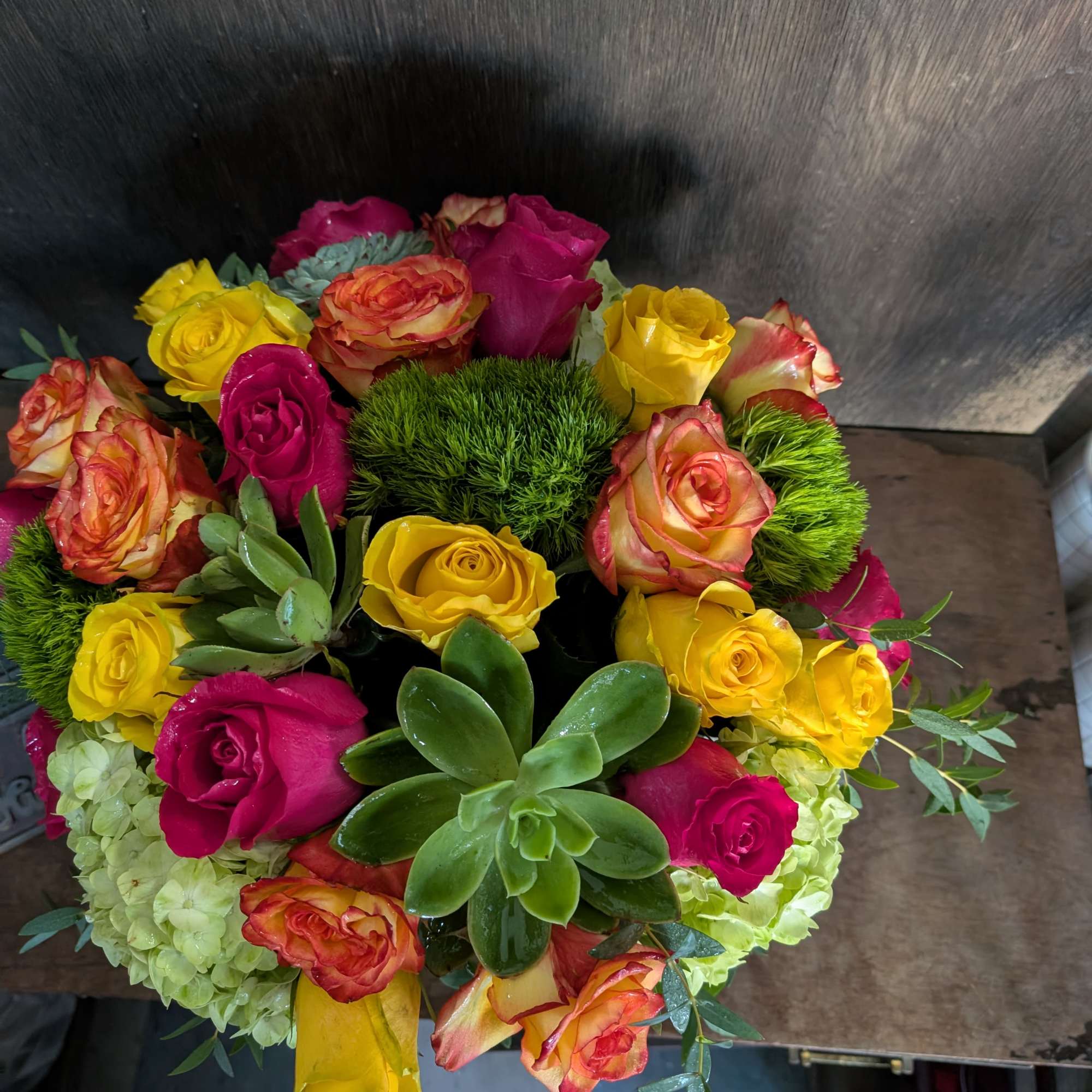 Assorted color roses, hydrangeas, succulents. So bright and up lifting. 