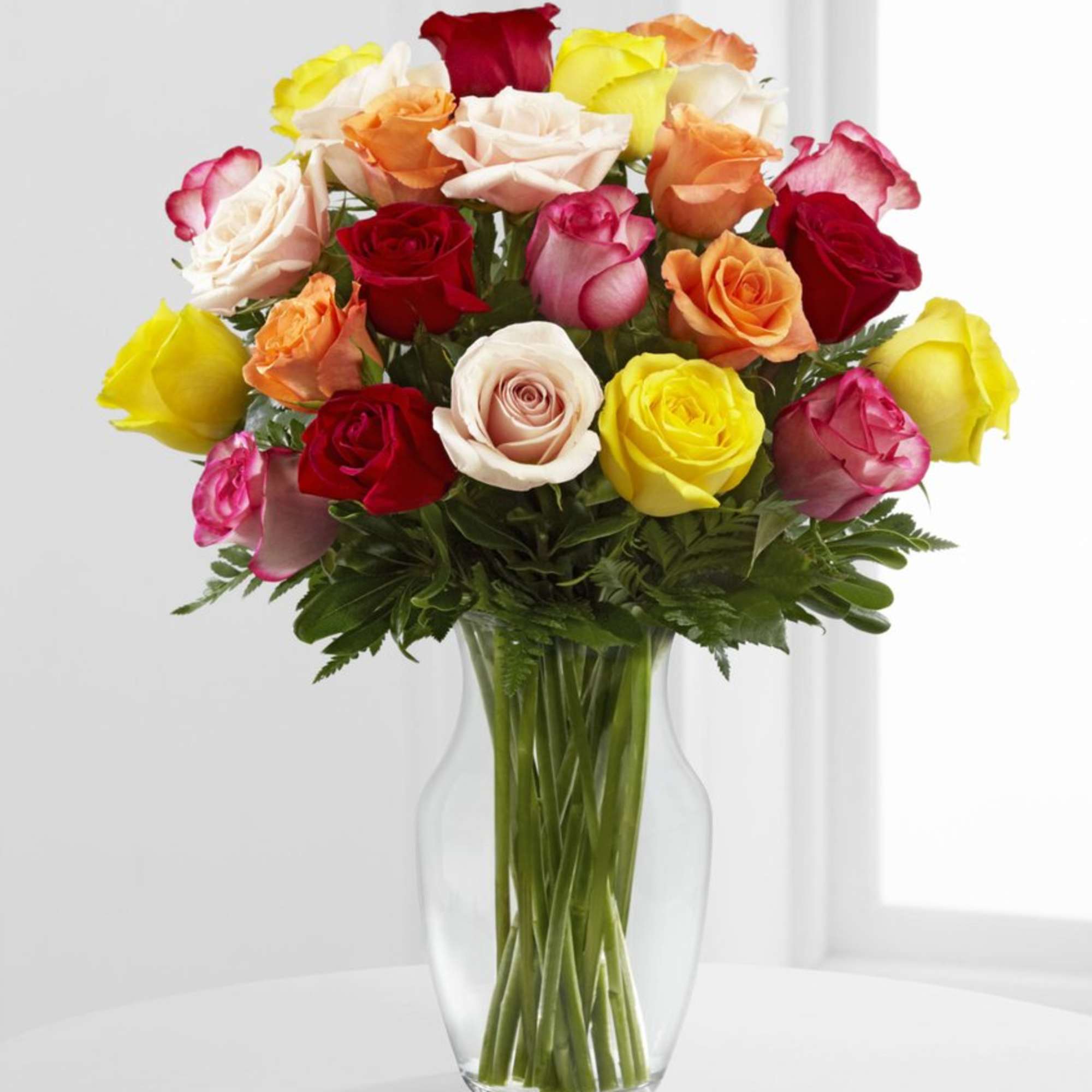 1 Dozen Mixed Roses.
Please note colors and container may vary.
