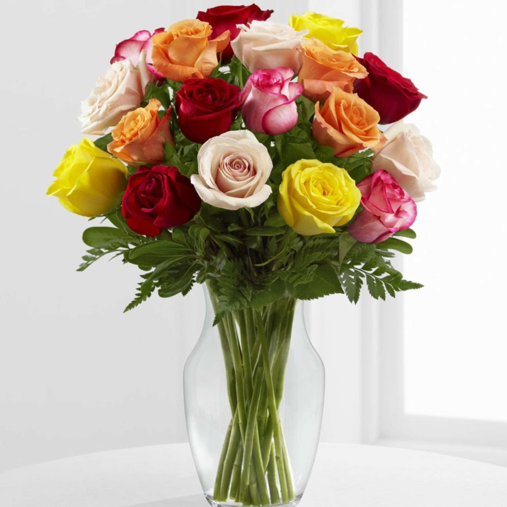 1 Dozen Mixed Roses.
Please note colors and container may vary.
