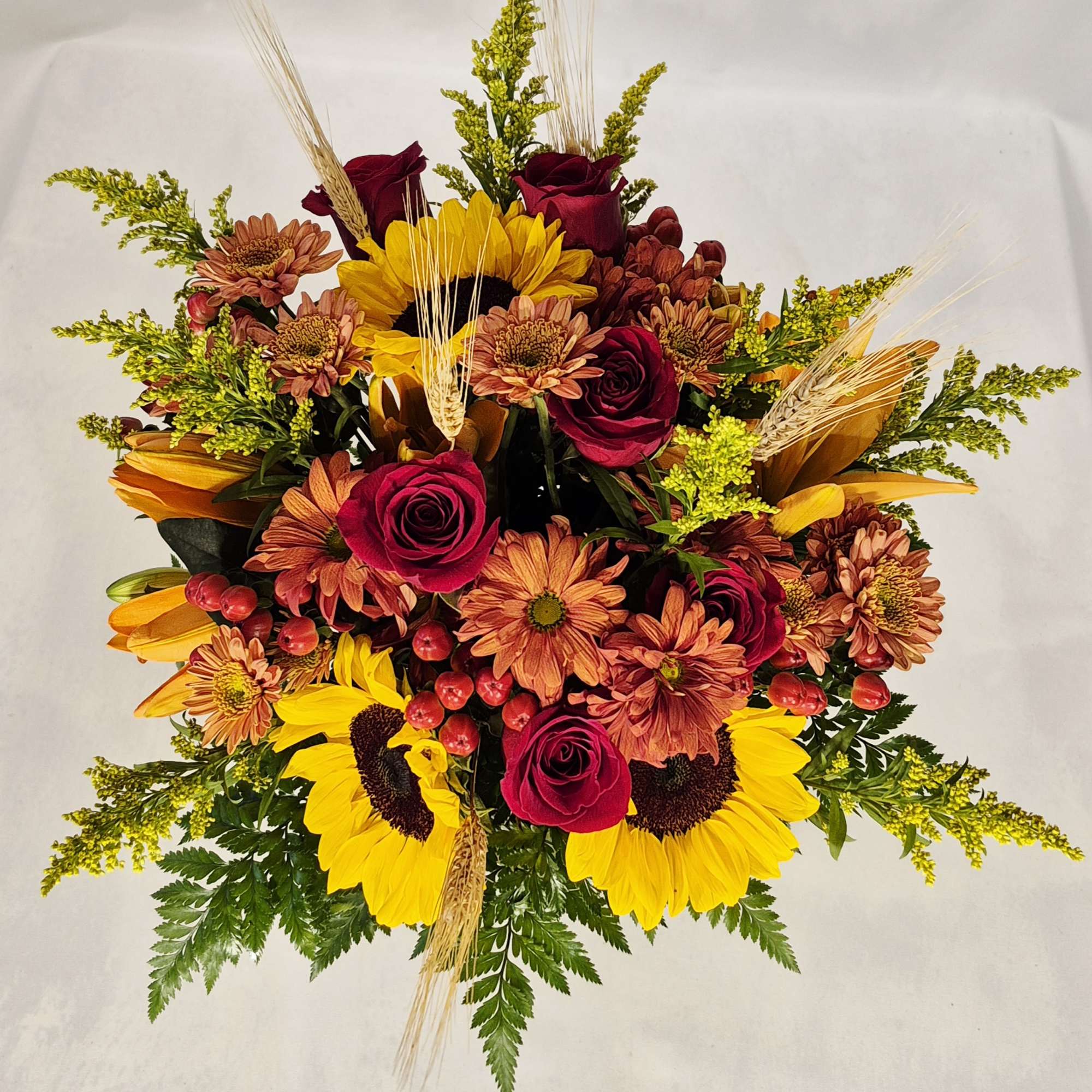 Welcome the fall season with this heartwarming fall bouquet. A vibrant mix
