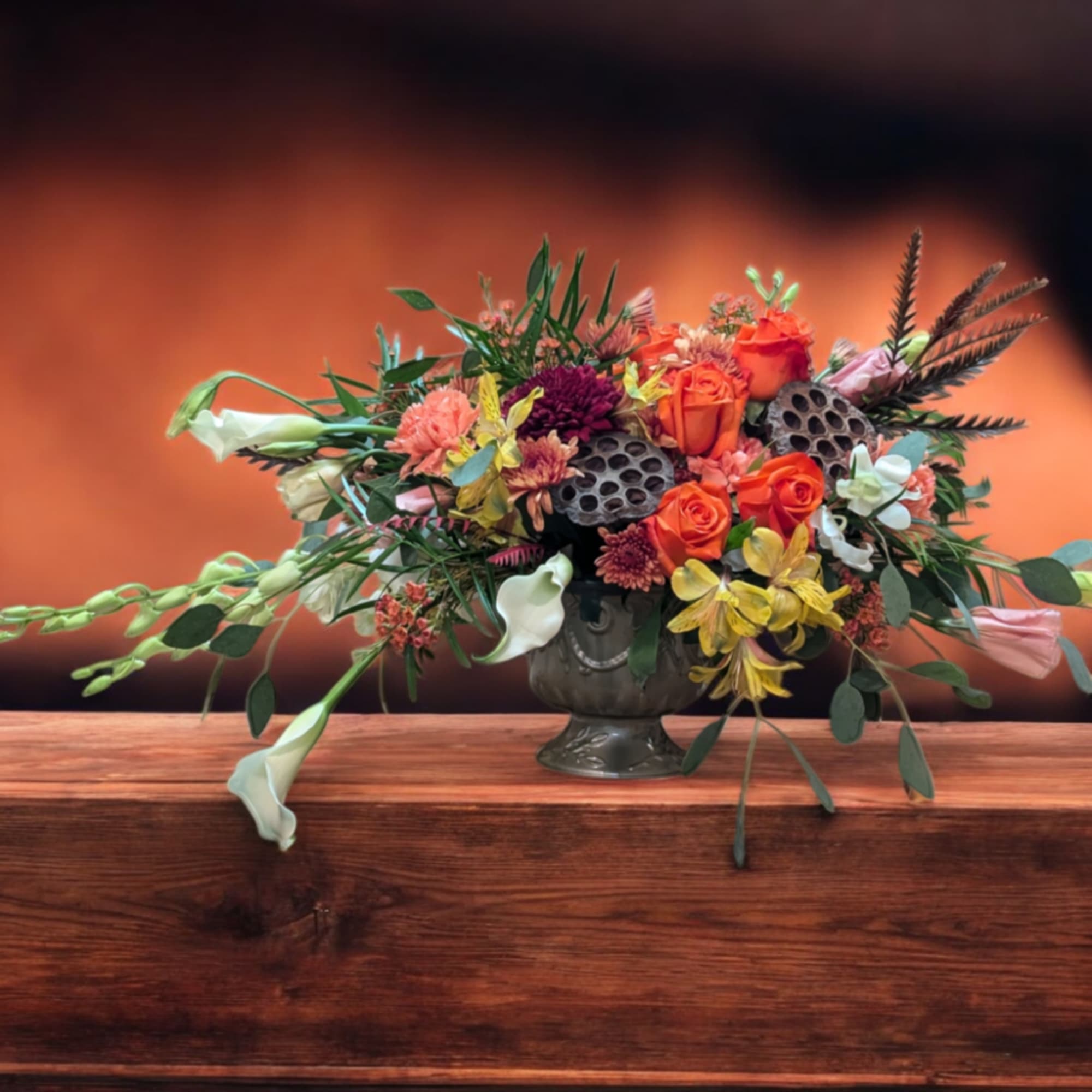 Elevate your autumn gatherings with the Autumn Radiance Centerpiece. A stunning display