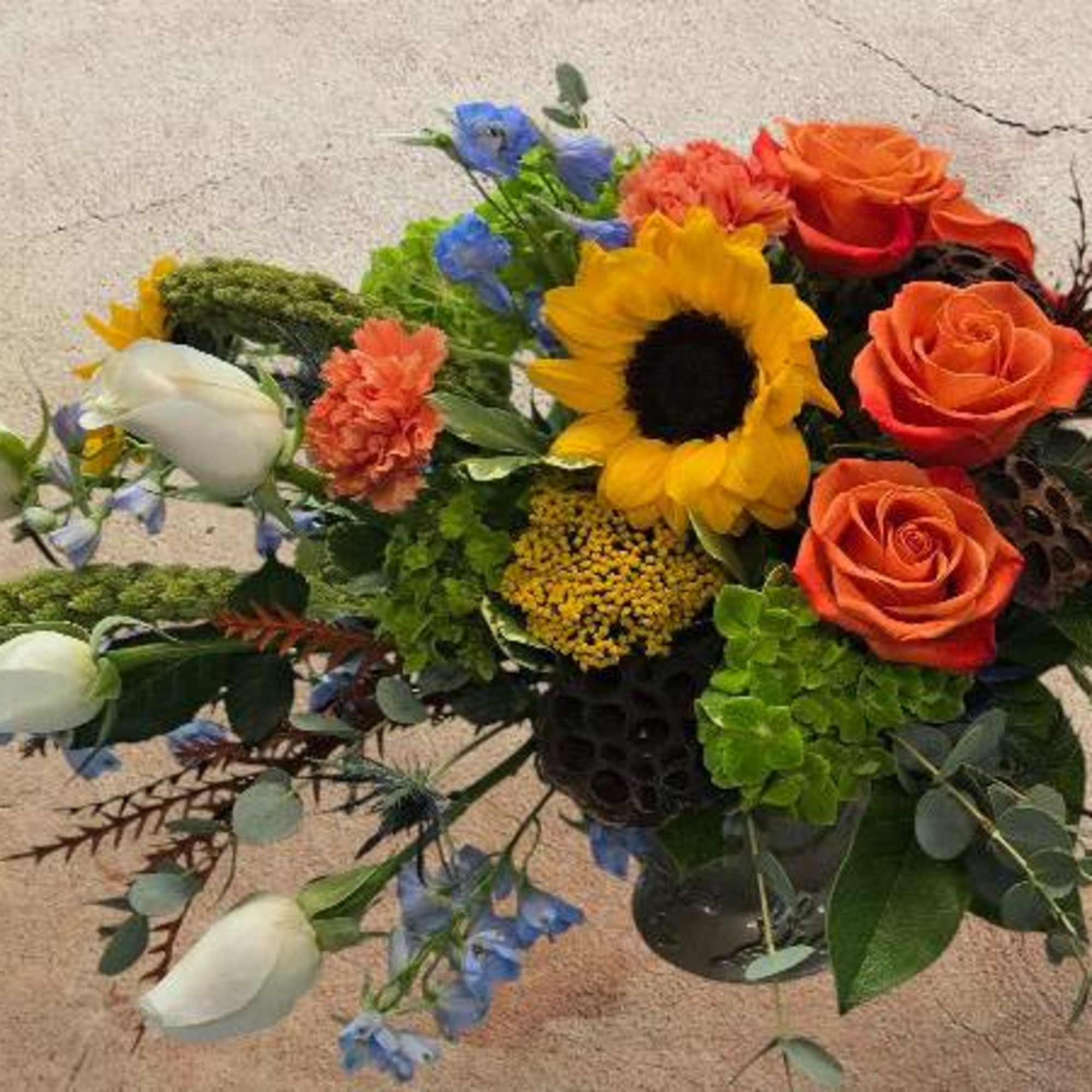 Elevate your autumn gatherings with the Autumn Radiance Centerpiece. A stunning display