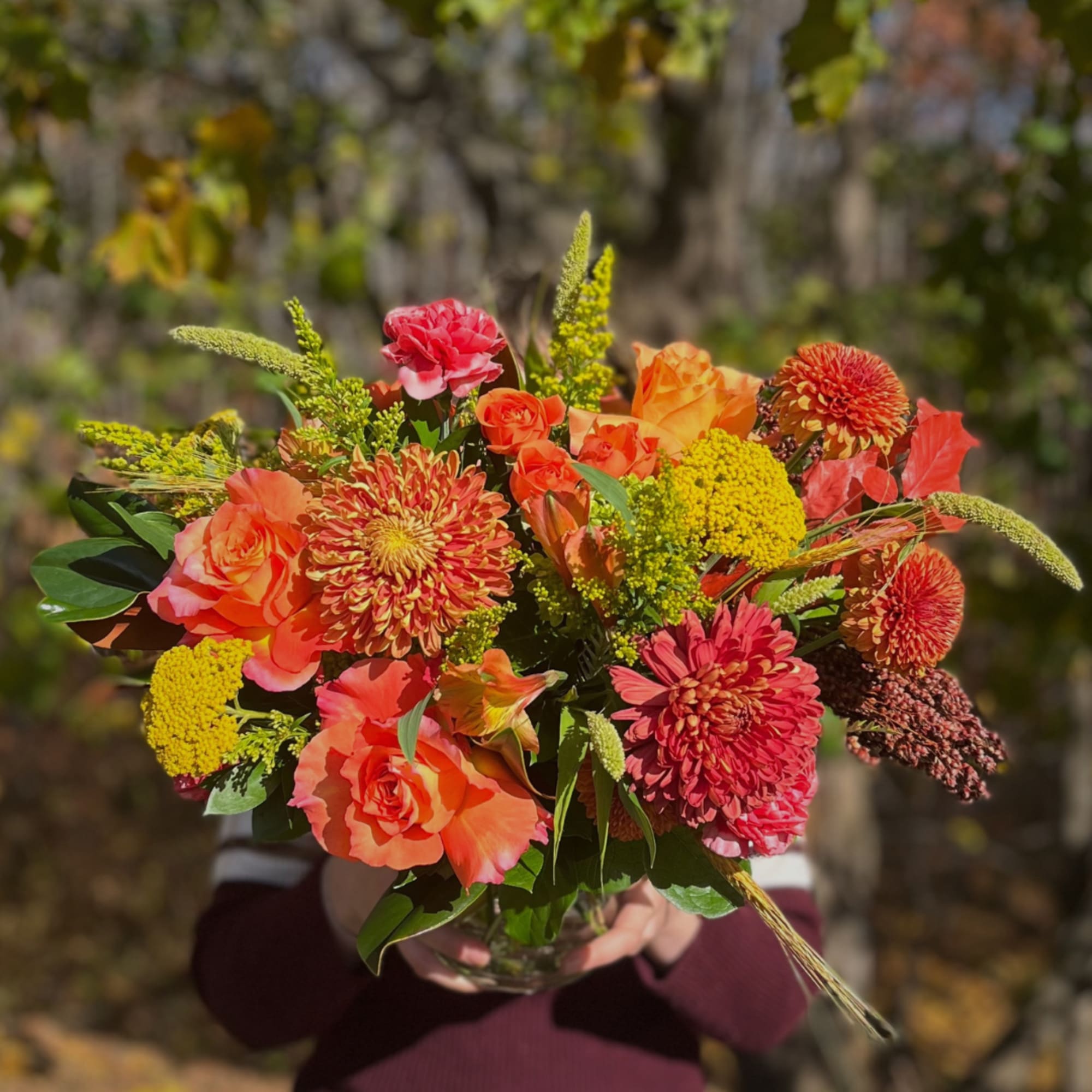 Warm Fall is a low and lush bouquet artfully designed in a