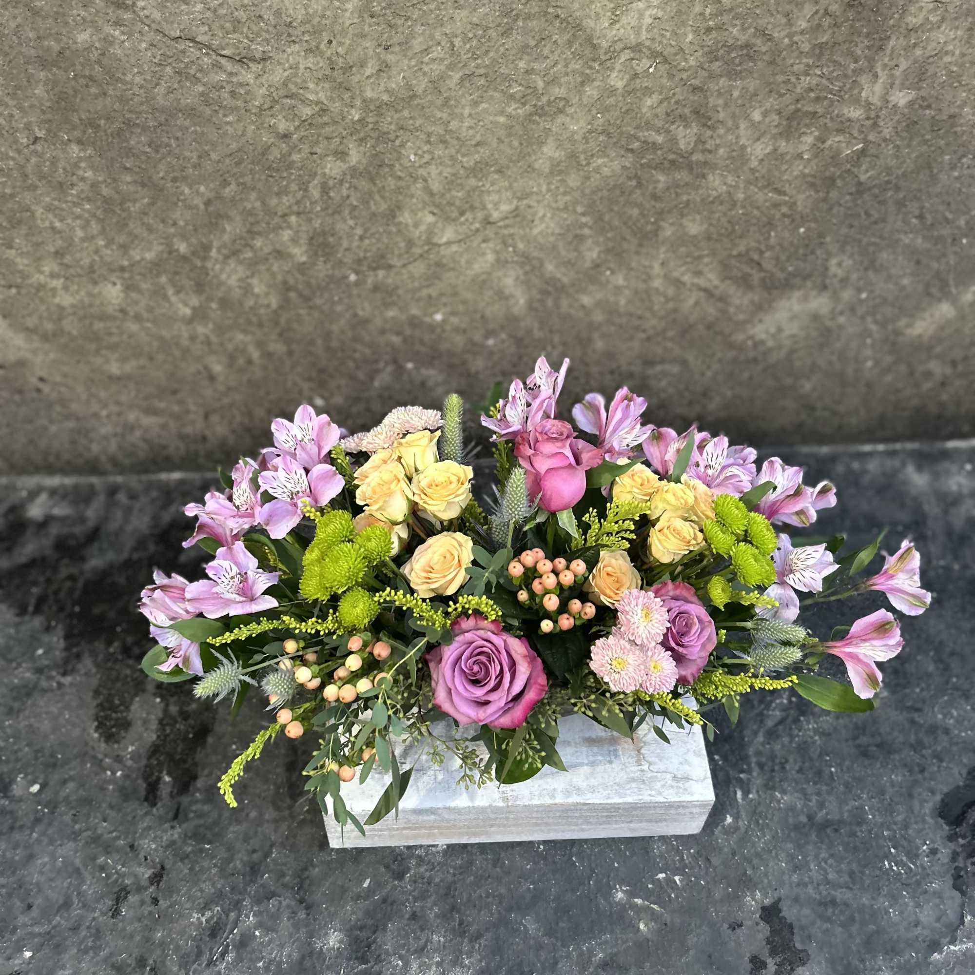 Small glass dish boat with Alstroemeria, berries, buttons, sprays roses and Roses