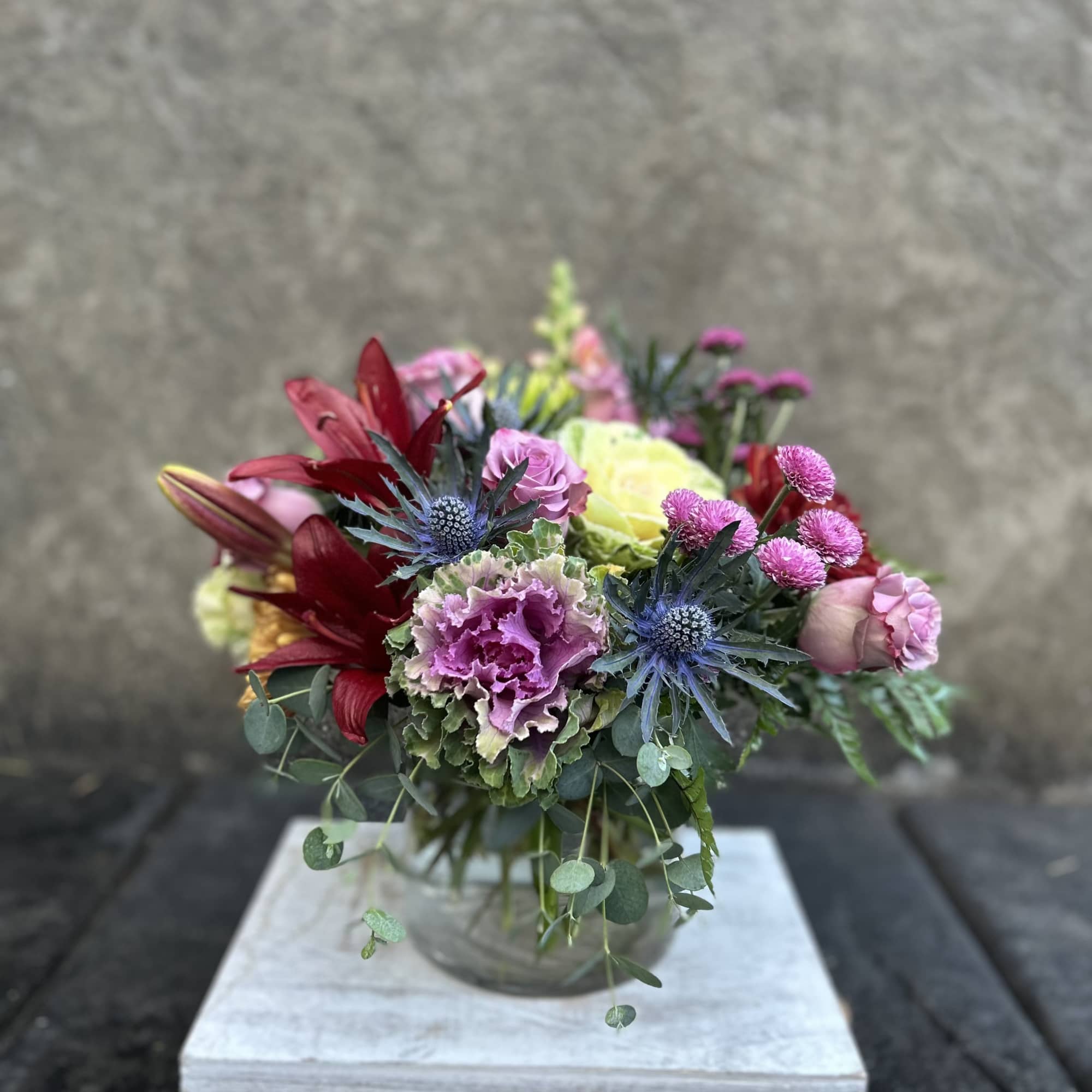 Decorative Kale , burgundy asiatic Lillies, chrysanthemums, lavender roses, snapdragons, eryngium, button