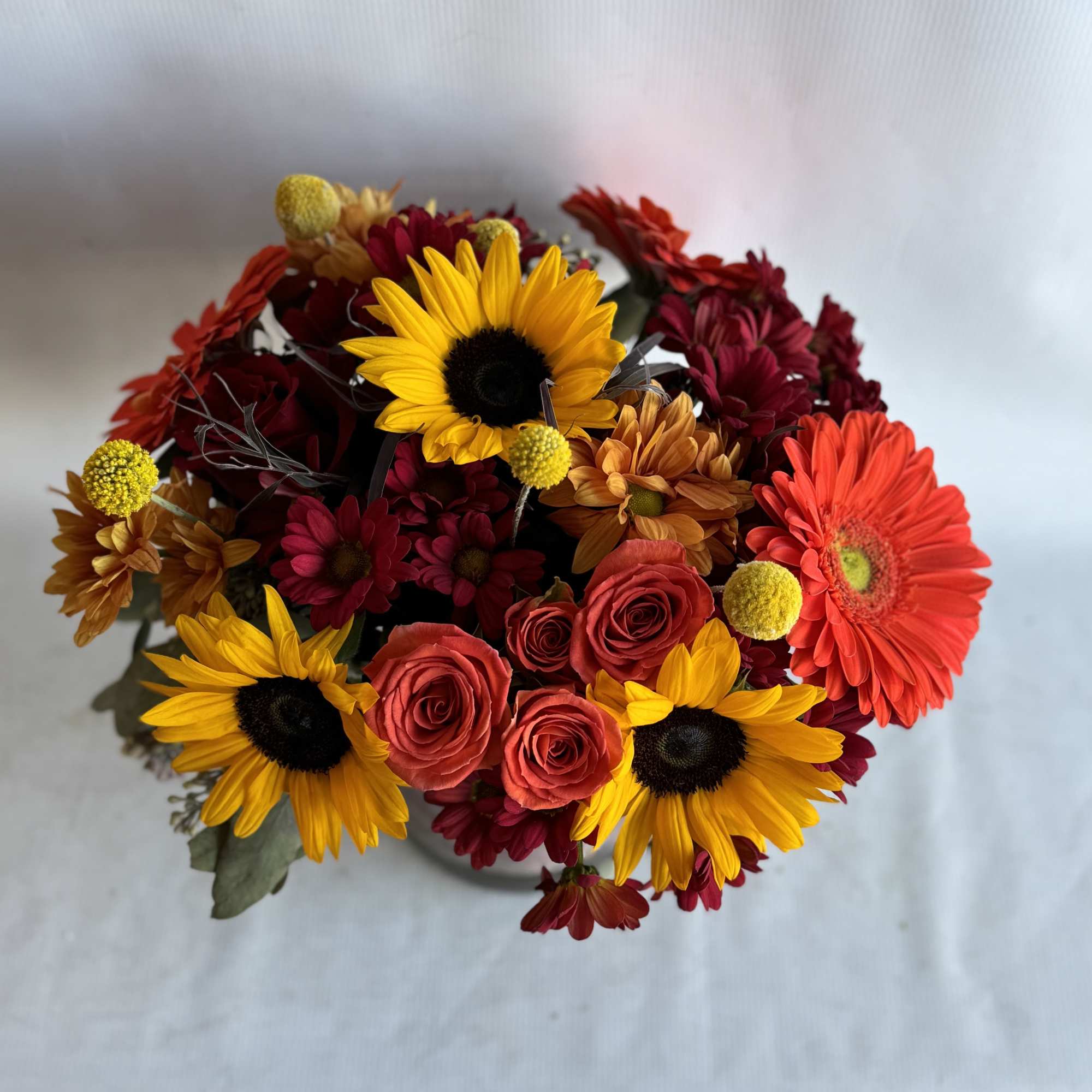 Brighten up the room with this cheery bouquet of sunflowers, Gerber daisies
