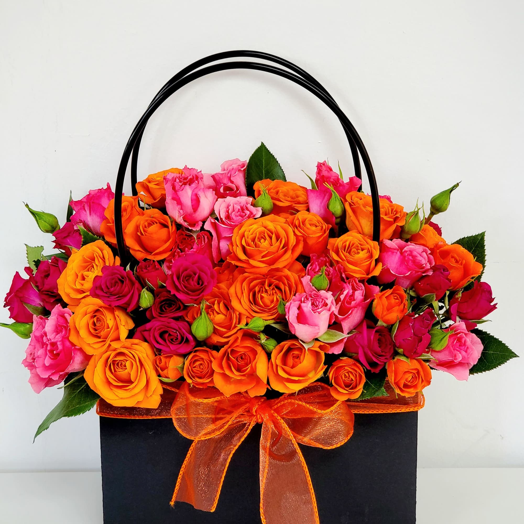 The Bag of Vivid Bloom is a striking, contemporary arrangement designed for
