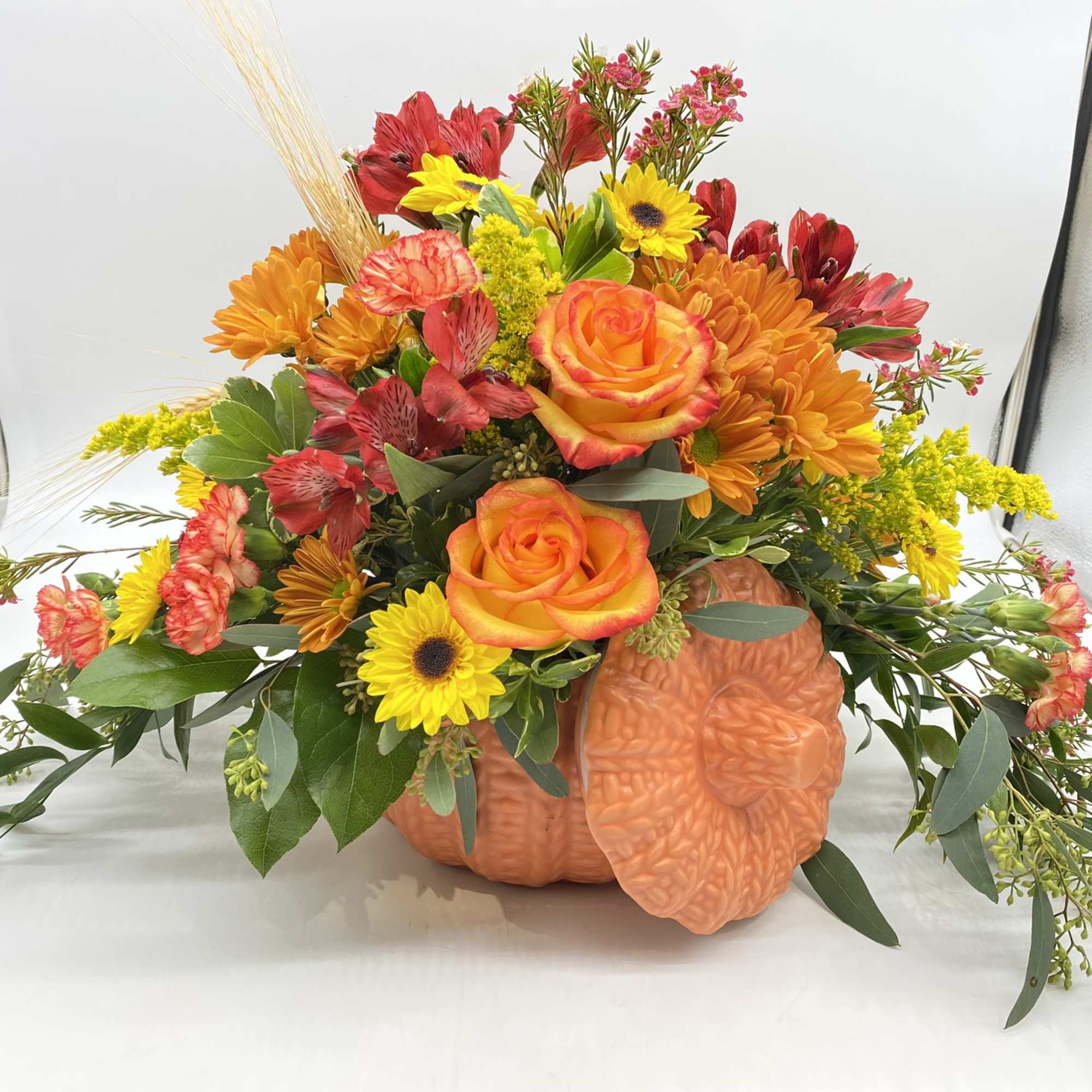 A fresh mix of Fall Favorites adorned in a keepsake ceramic pumpkin