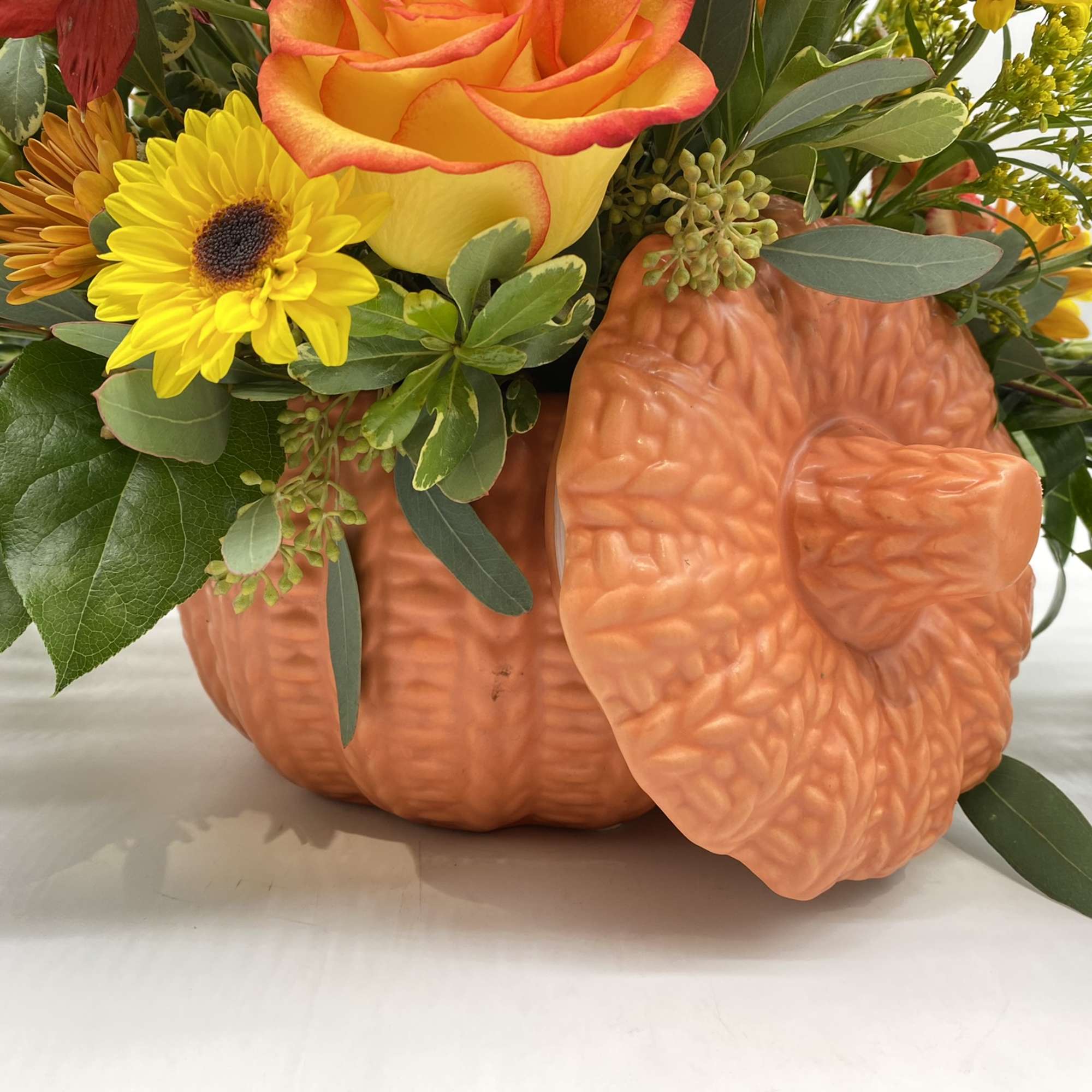 A fresh mix of Fall Favorites adorned in a keepsake ceramic pumpkin