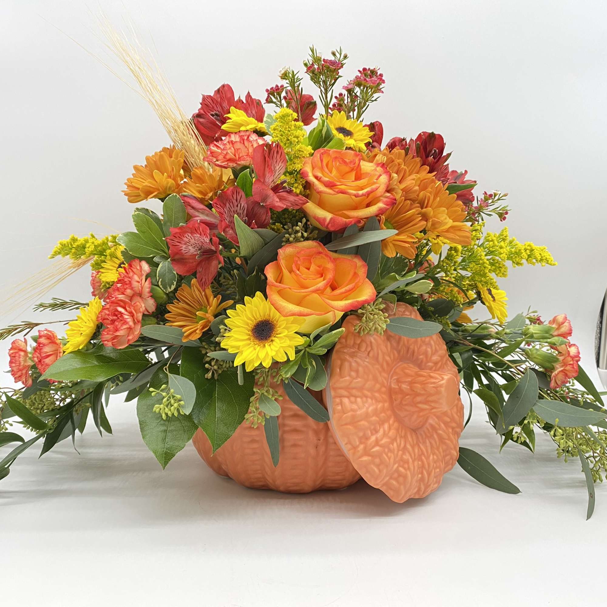 A fresh mix of Fall Favorites adorned in a keepsake ceramic pumpkin
