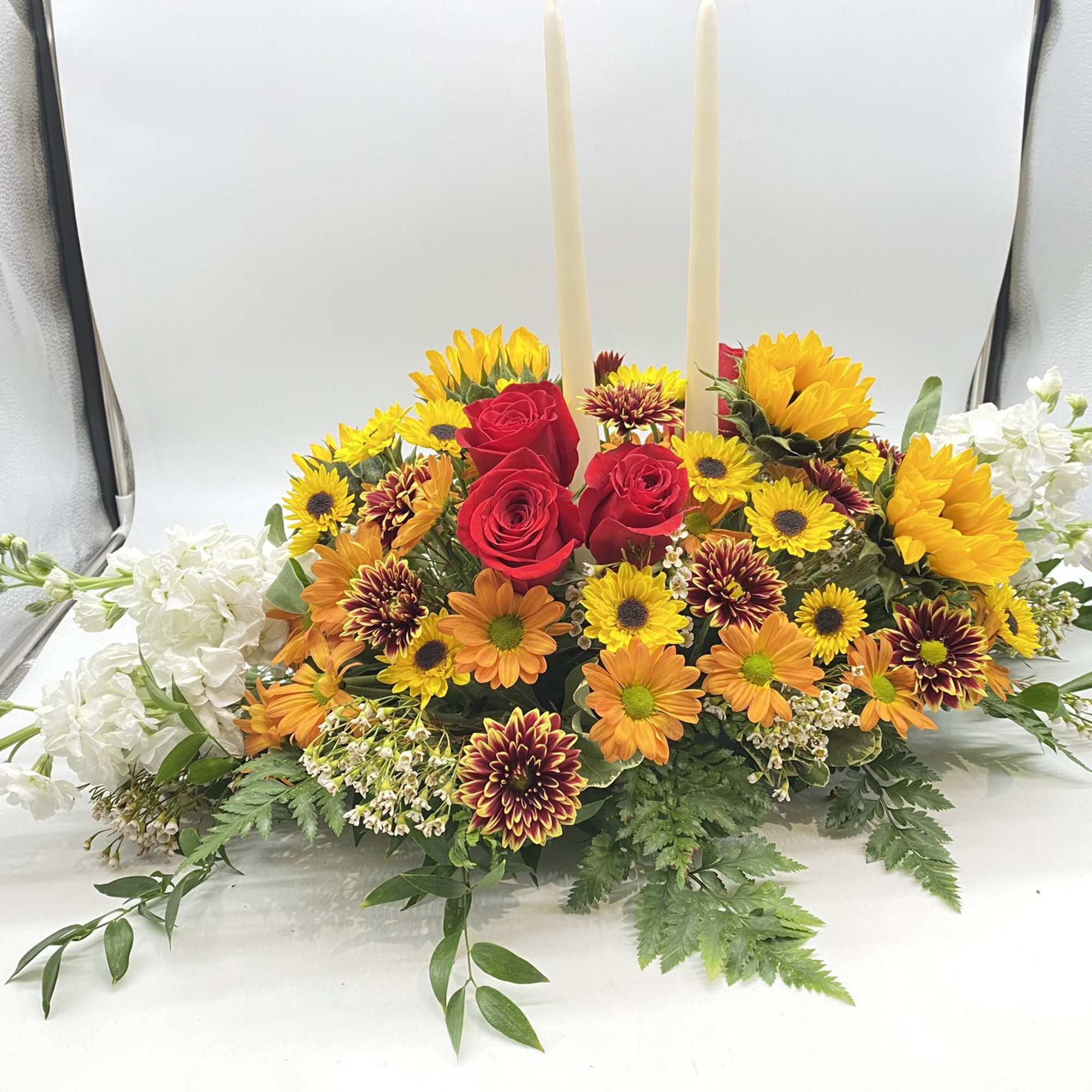 A seasonal centerpiece with yellow hues to wow the recipient...