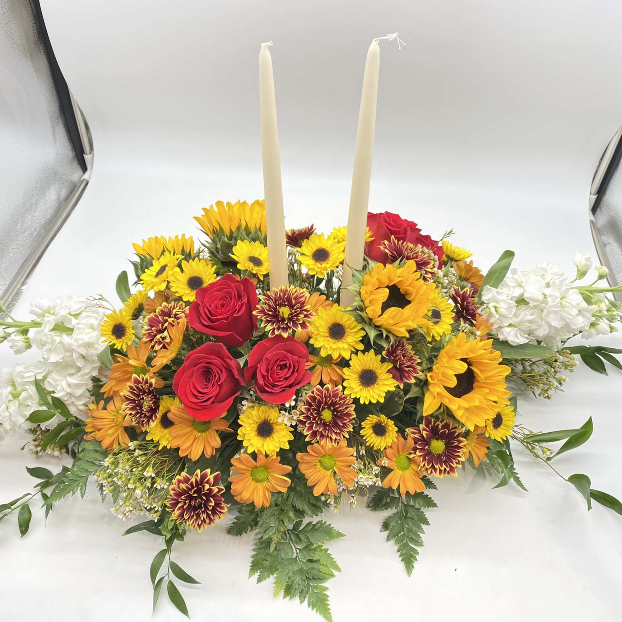 A seasonal centerpiece with yellow hues to wow the recipient...
