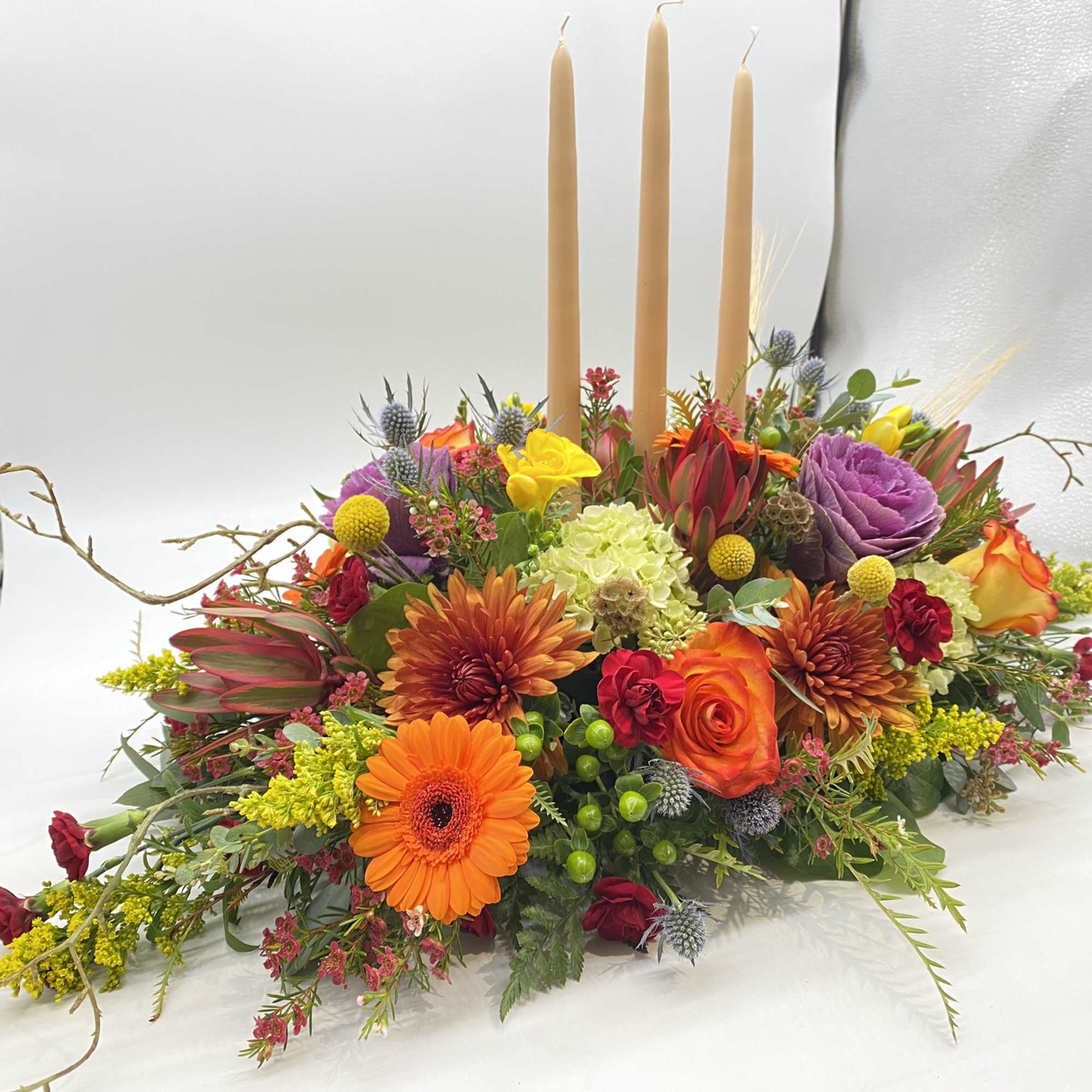 This centerpiece is adorned with all your Fall favorite flowers and tones...
The