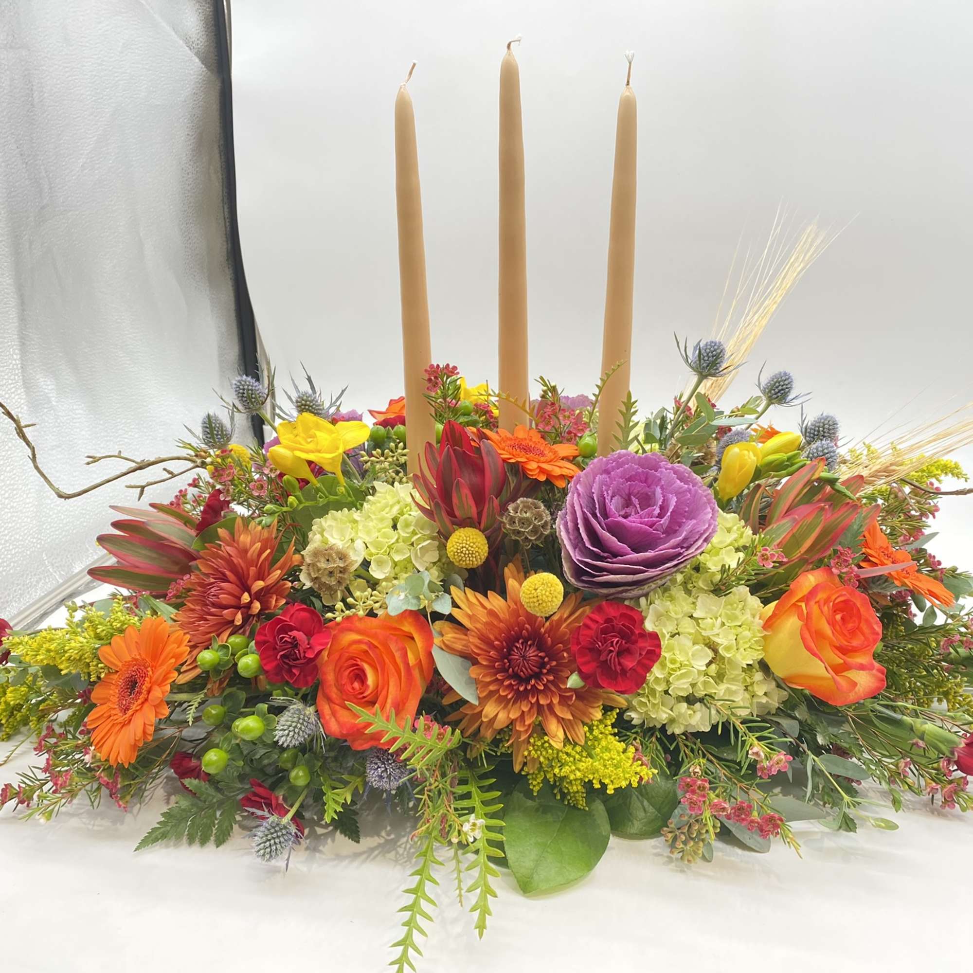 This centerpiece is adorned with all your Fall favorite flowers and tones...
The