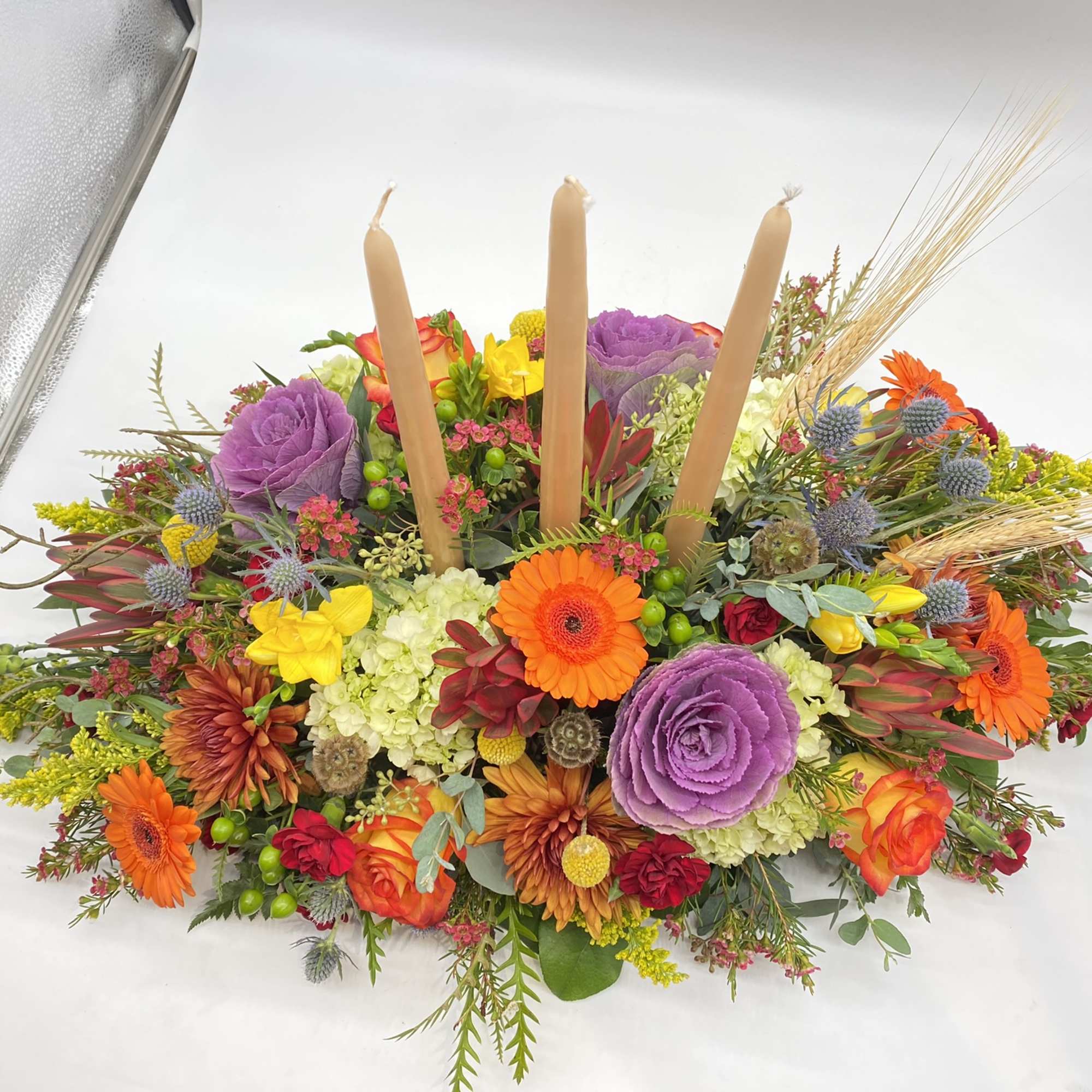 This centerpiece is adorned with all your Fall favorite flowers and tones...
The